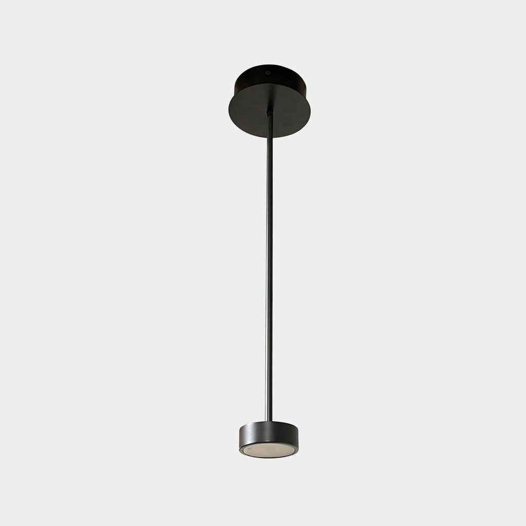 A Giopato & Coombes Softspot Pendant light hanging from a ceiling.