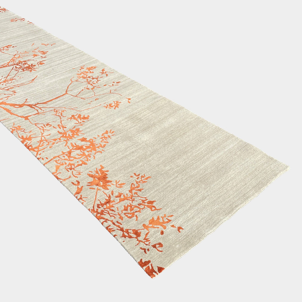 A Delinear Oak Runner field rug with silk pattern featuring red and blue leaves.