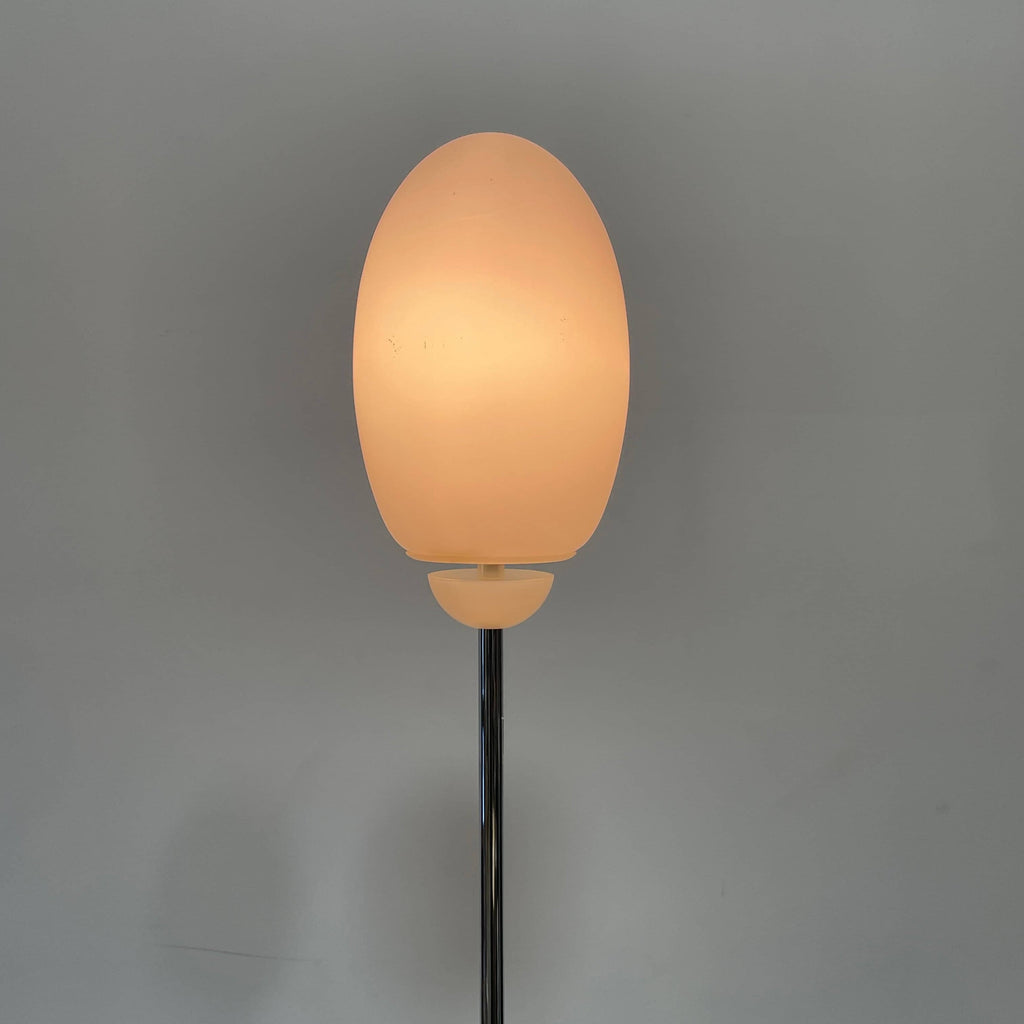 A Flos Brera Floor Light, emits diffused light on a white background.