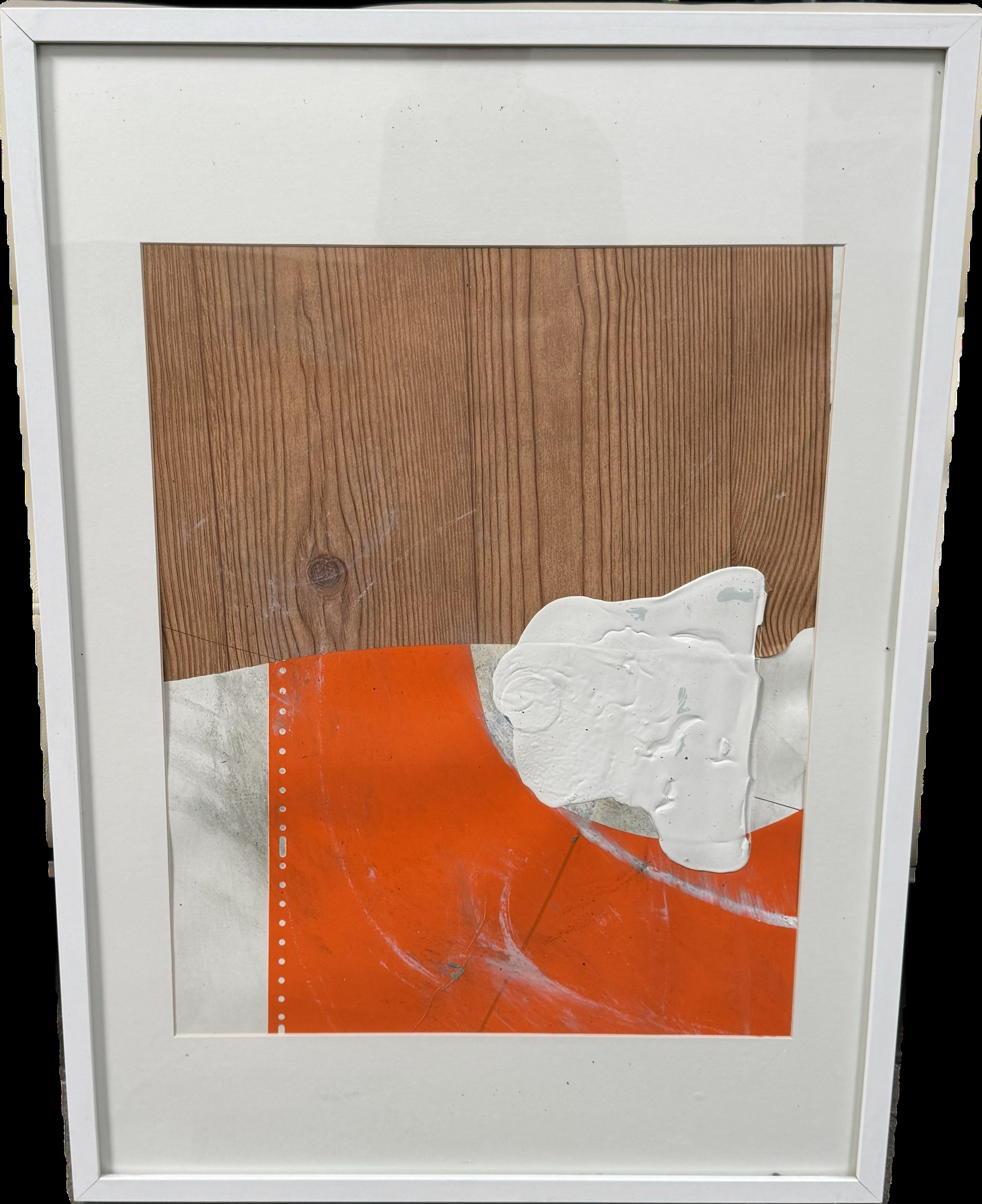 The "Allison Caesar Mixed Media Collage Orange and Wood Panel" by Modern Resale features abstract artwork with a wood grain pattern at the top, an orange section accented with white paint in the lower half, and a textured white shape overlapping both areas, all elegantly framed in white.