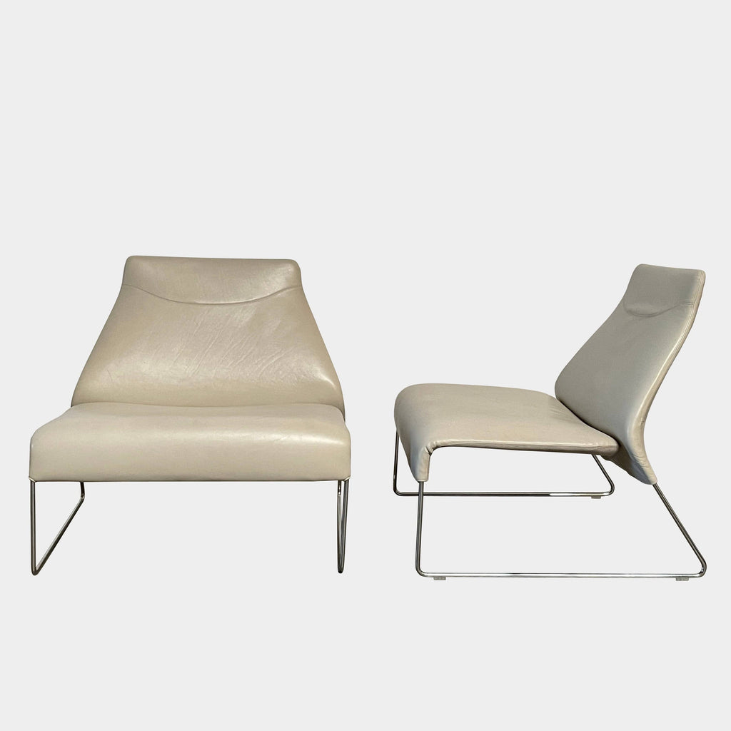 Description: A B&B Italia Lazy Lounge Chair with a white metal frame.
