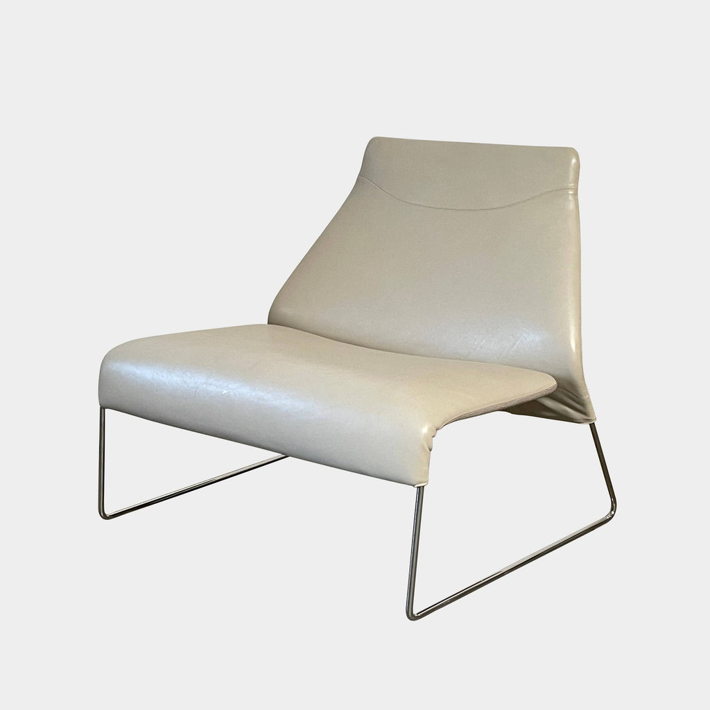 Description: A B&B Italia Lazy Lounge Chair with a white metal frame.