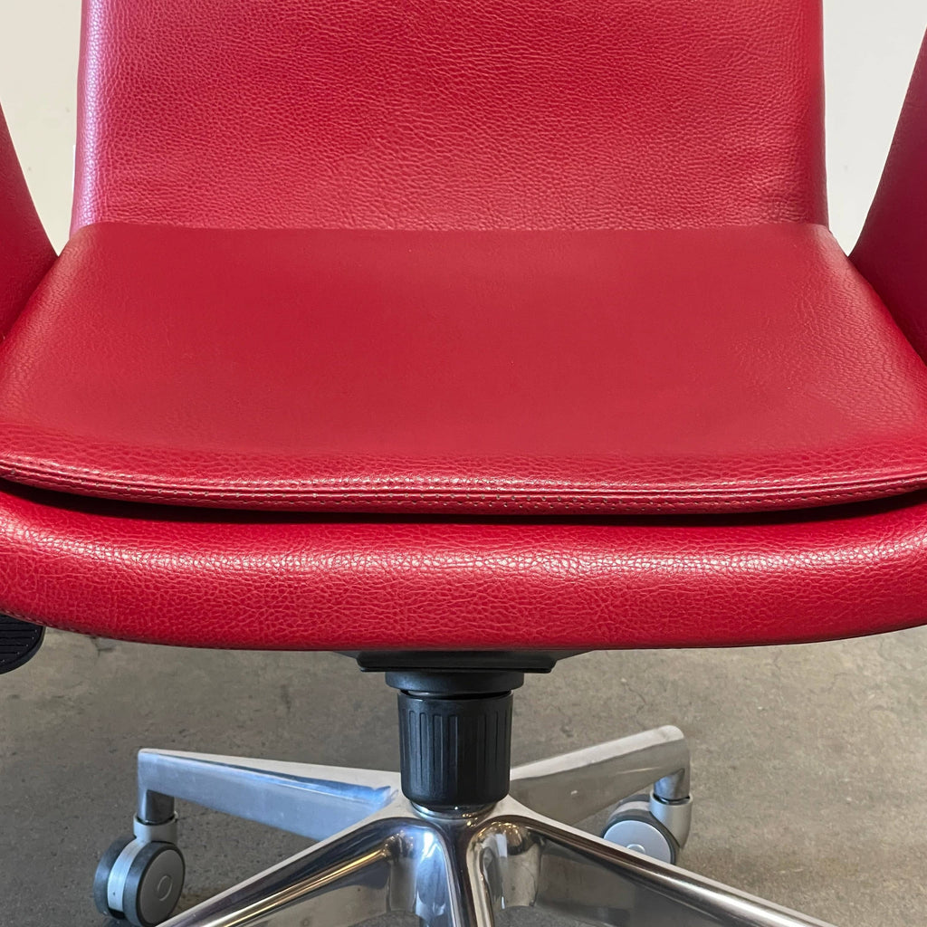 A Zanotta 2280 Lady Task Chair, adorned in red leather, placed on a crisp white background.