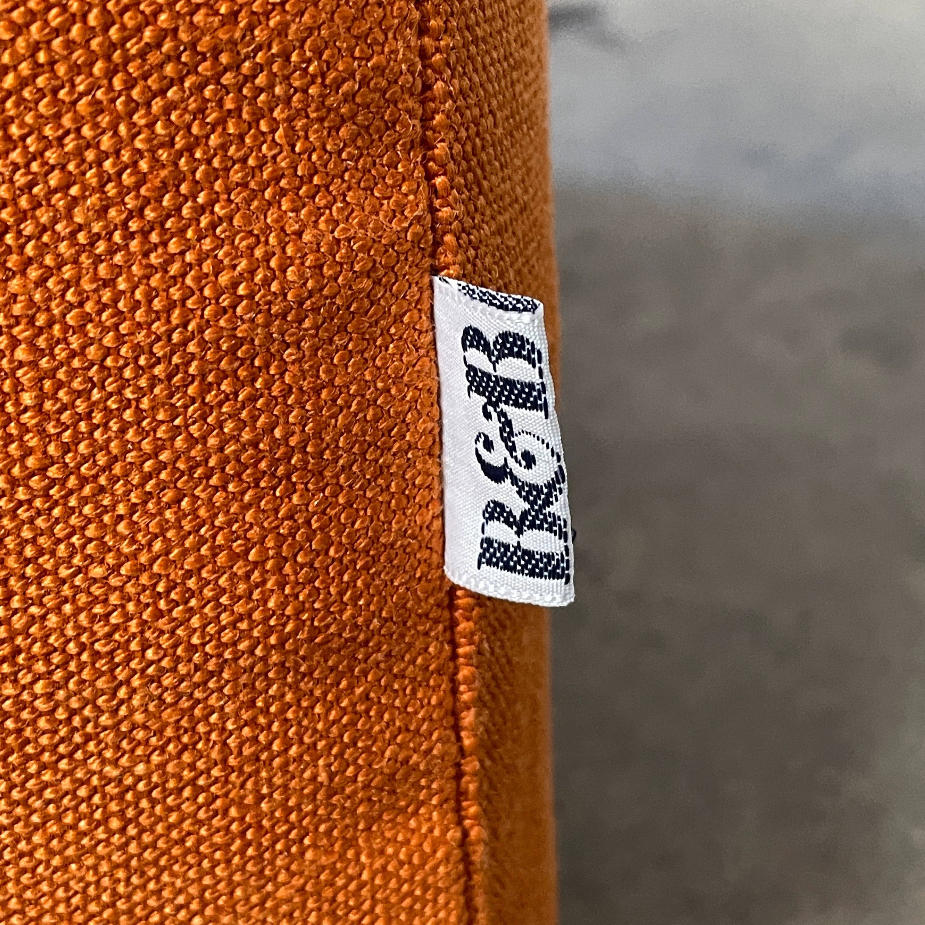 A small B&B Italia P60 ottoman on a white background.