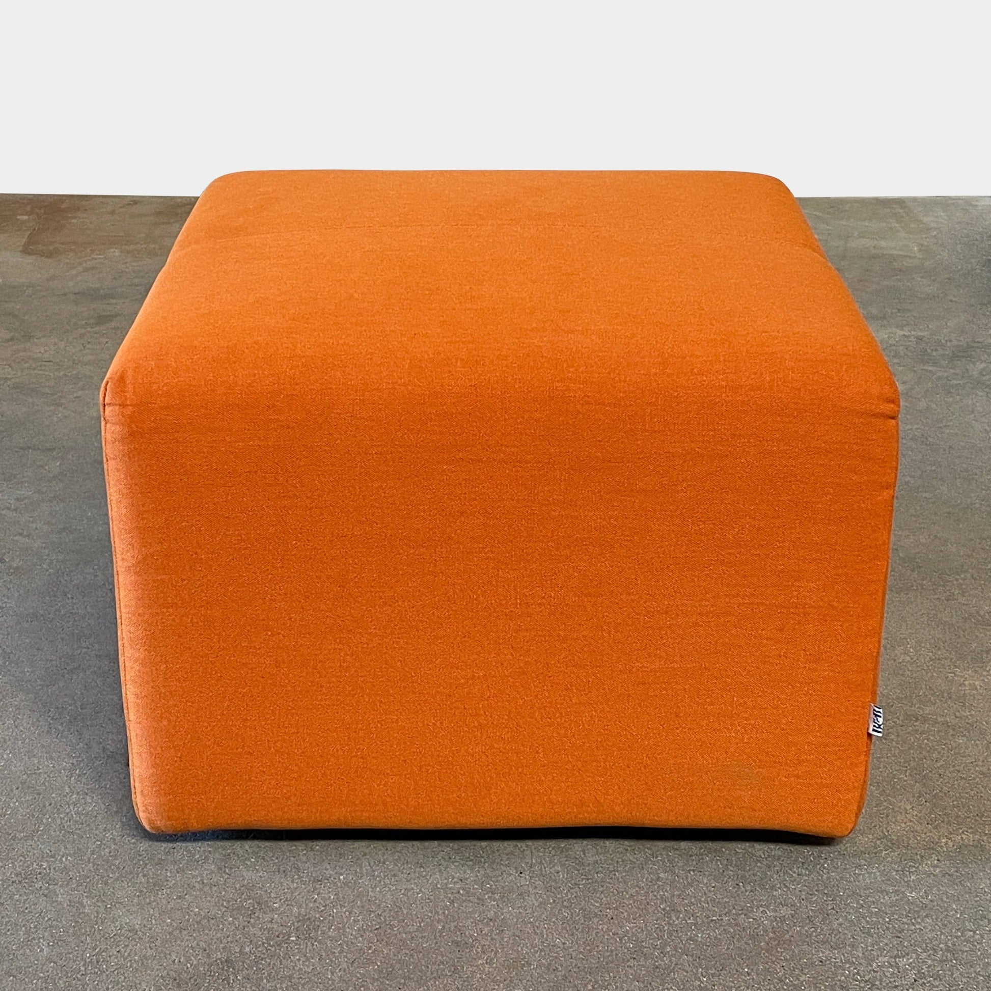 A small B&B Italia P60 ottoman on a white background.