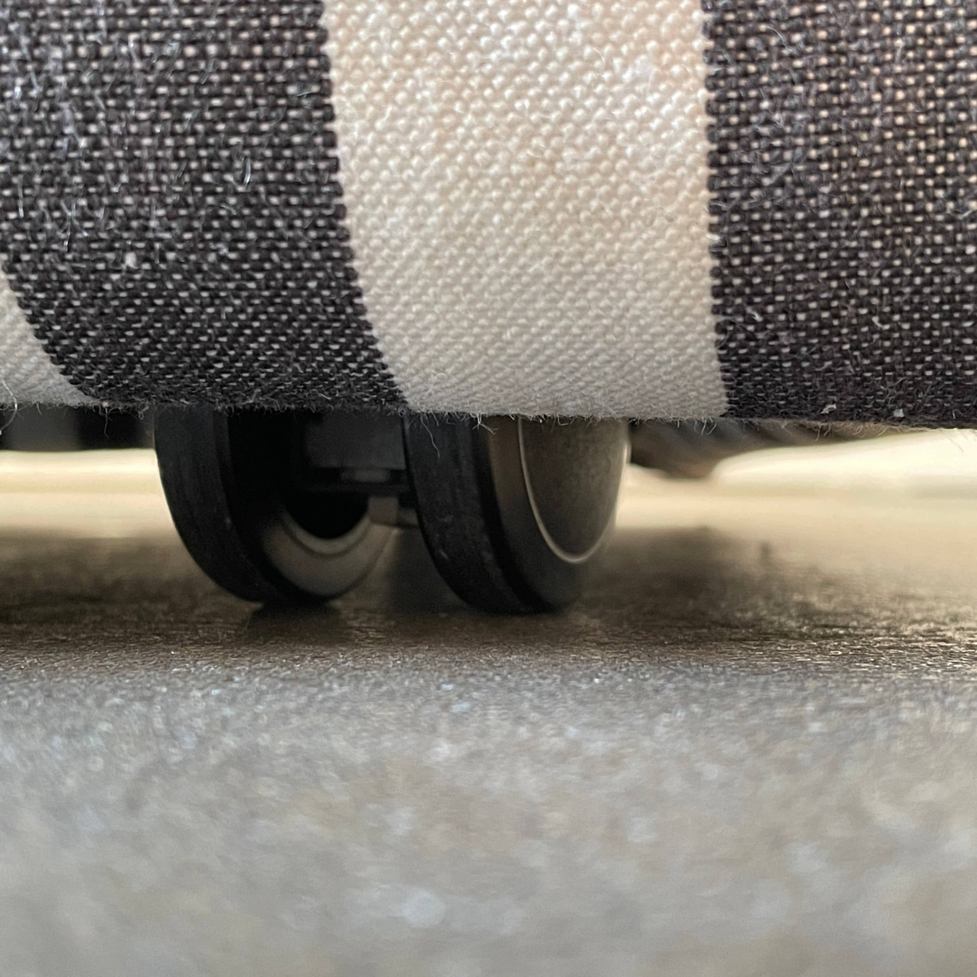 A small B&B Italia P60 ottoman on a white background.