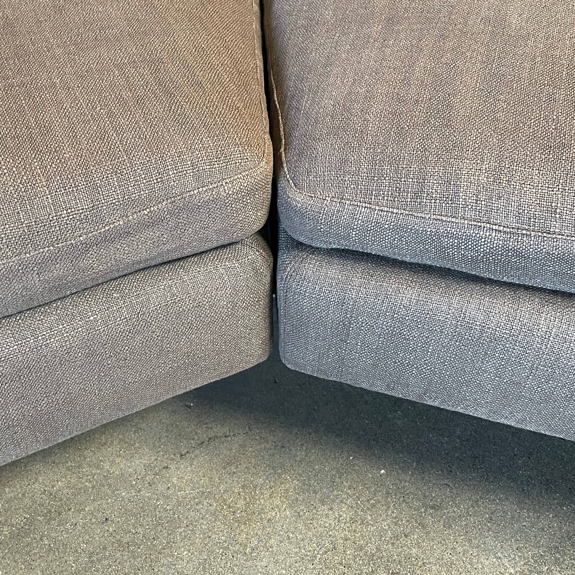 Modern upholstered l-shaped sectional B&B Italia Arne Sofa designed by Antonio Citterio, with cushions on a white background.