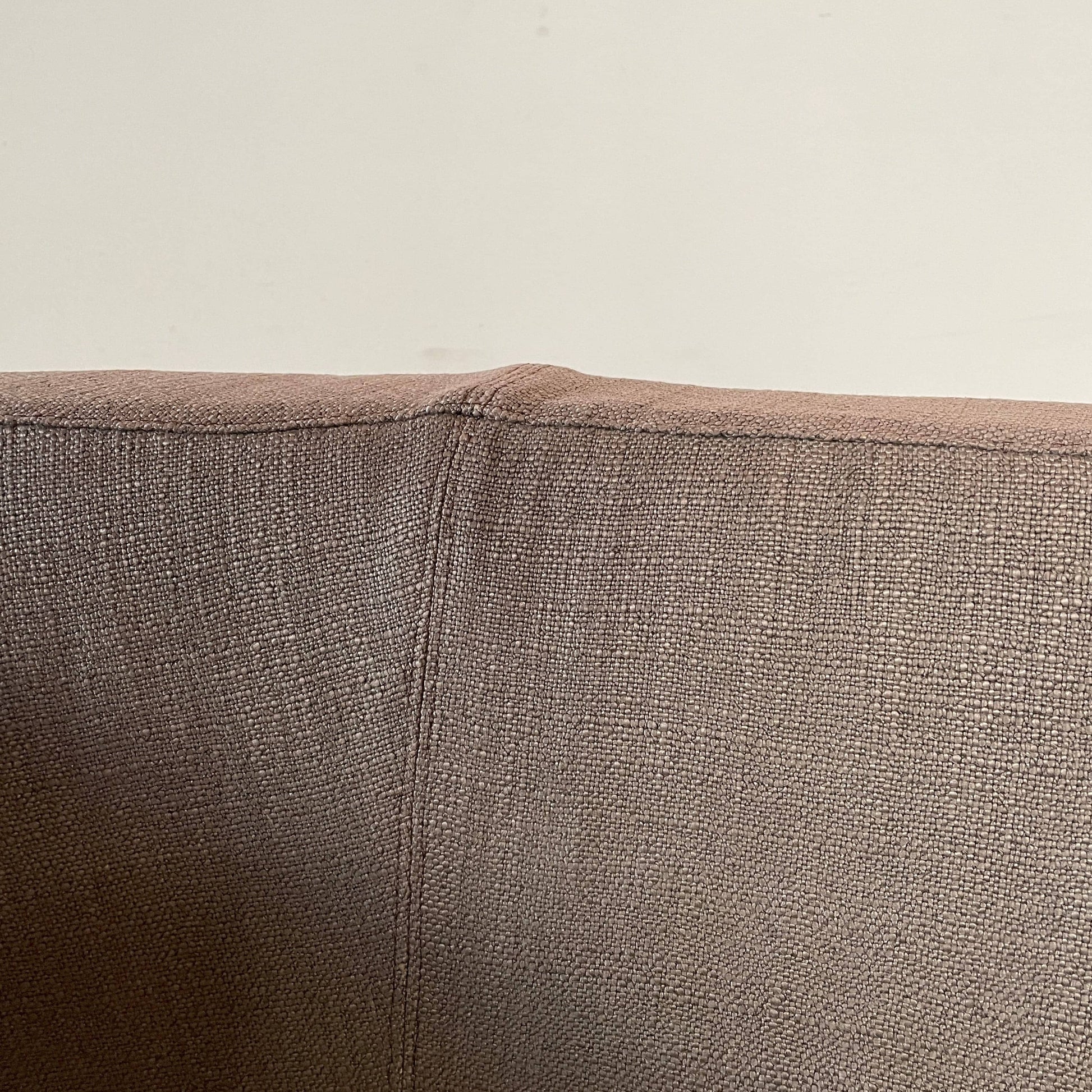 Modern upholstered l-shaped sectional B&B Italia Arne Sofa designed by Antonio Citterio, with cushions on a white background.