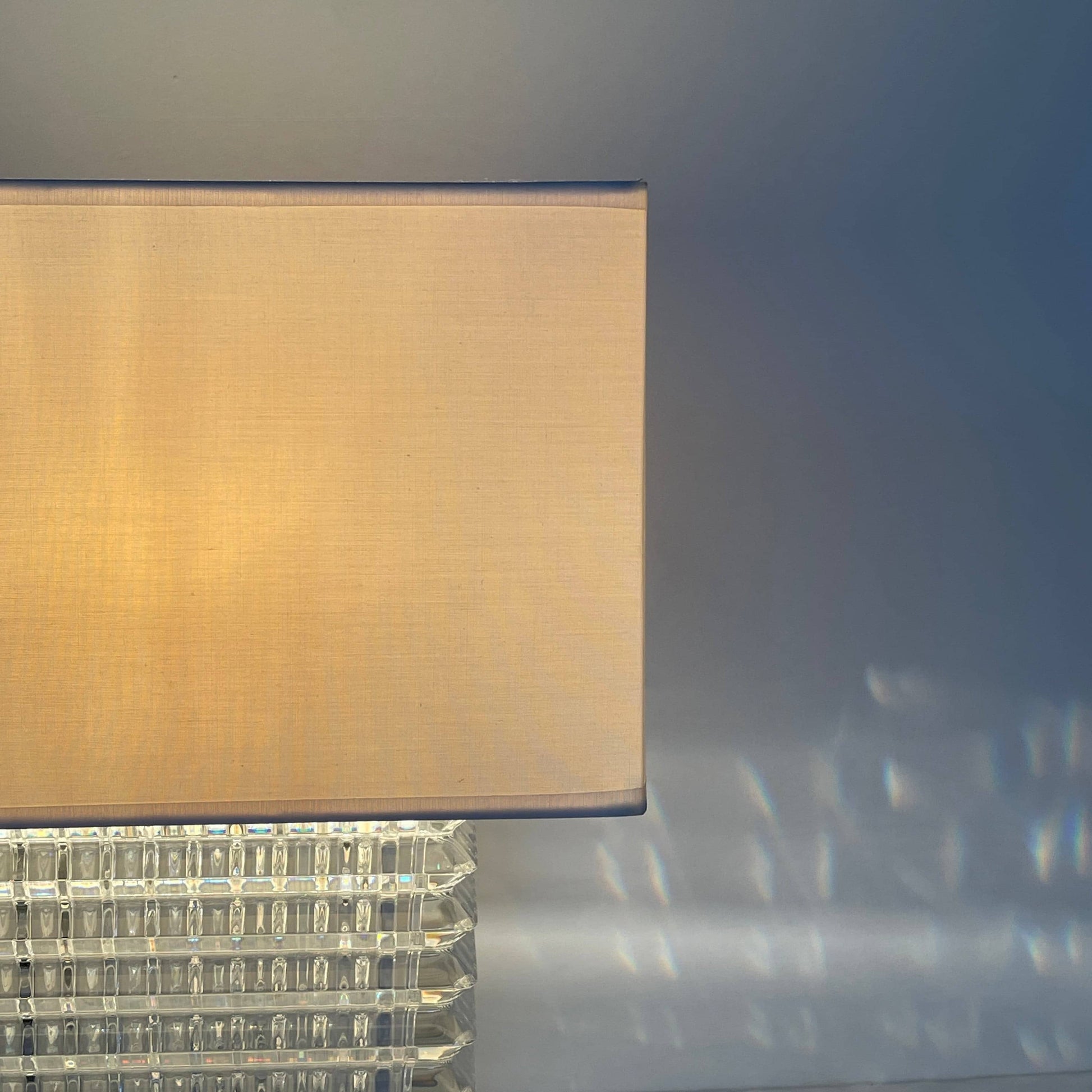 An elegant Baccarat Eye Table Lamp with a white shade designed by Nicolas Triboulot.