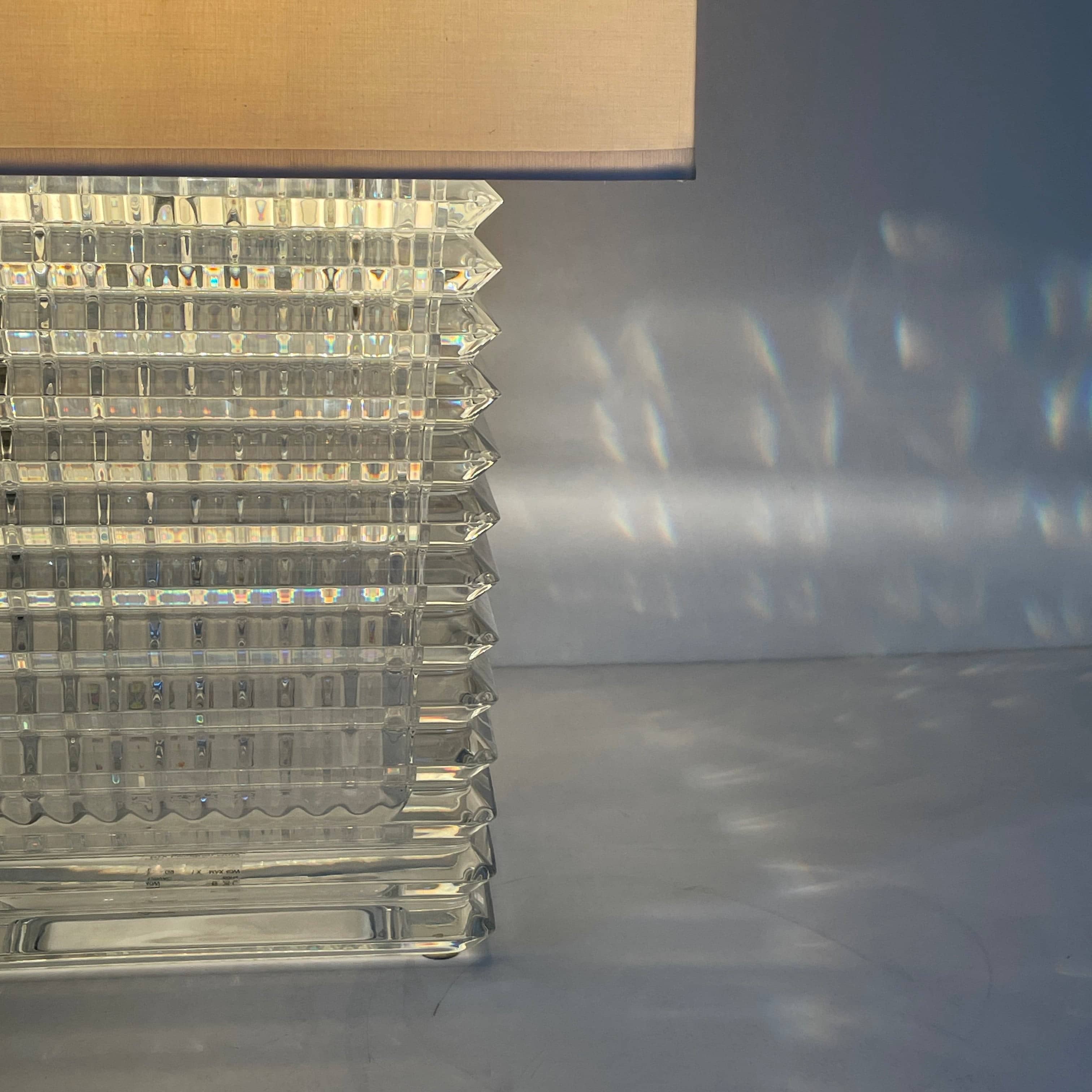 An elegant Baccarat Eye Table Lamp with a white shade designed by Nicolas Triboulot.