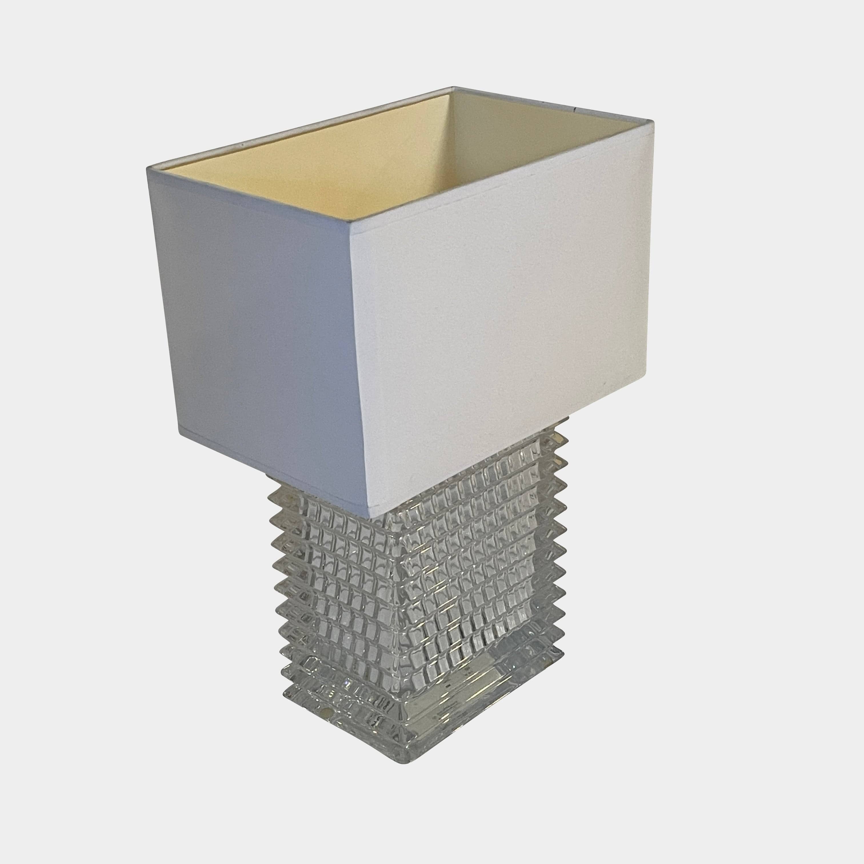 An elegant Baccarat Eye Table Lamp with a white shade designed by Nicolas Triboulot.