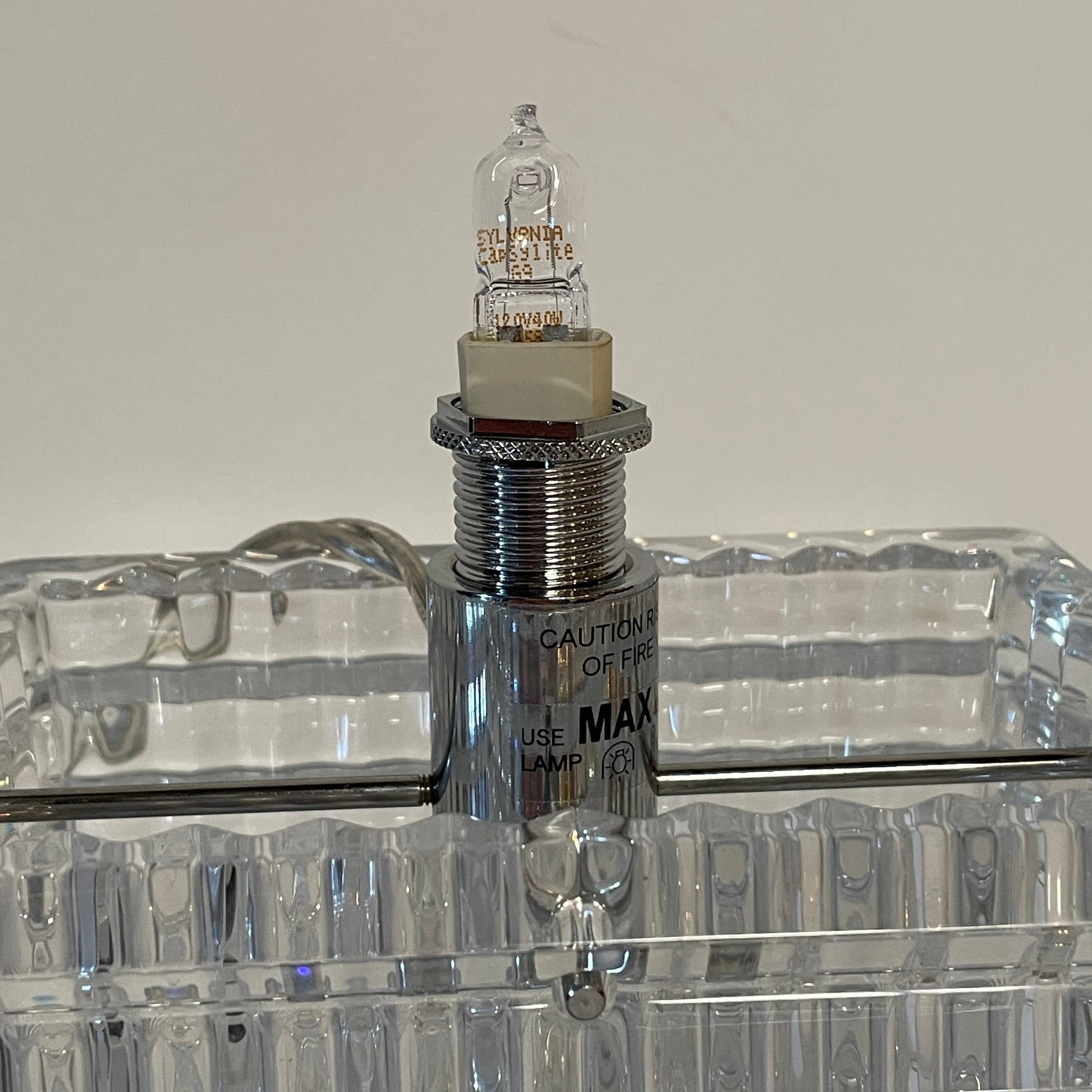 An elegant Baccarat Eye Table Lamp with a white shade designed by Nicolas Triboulot.