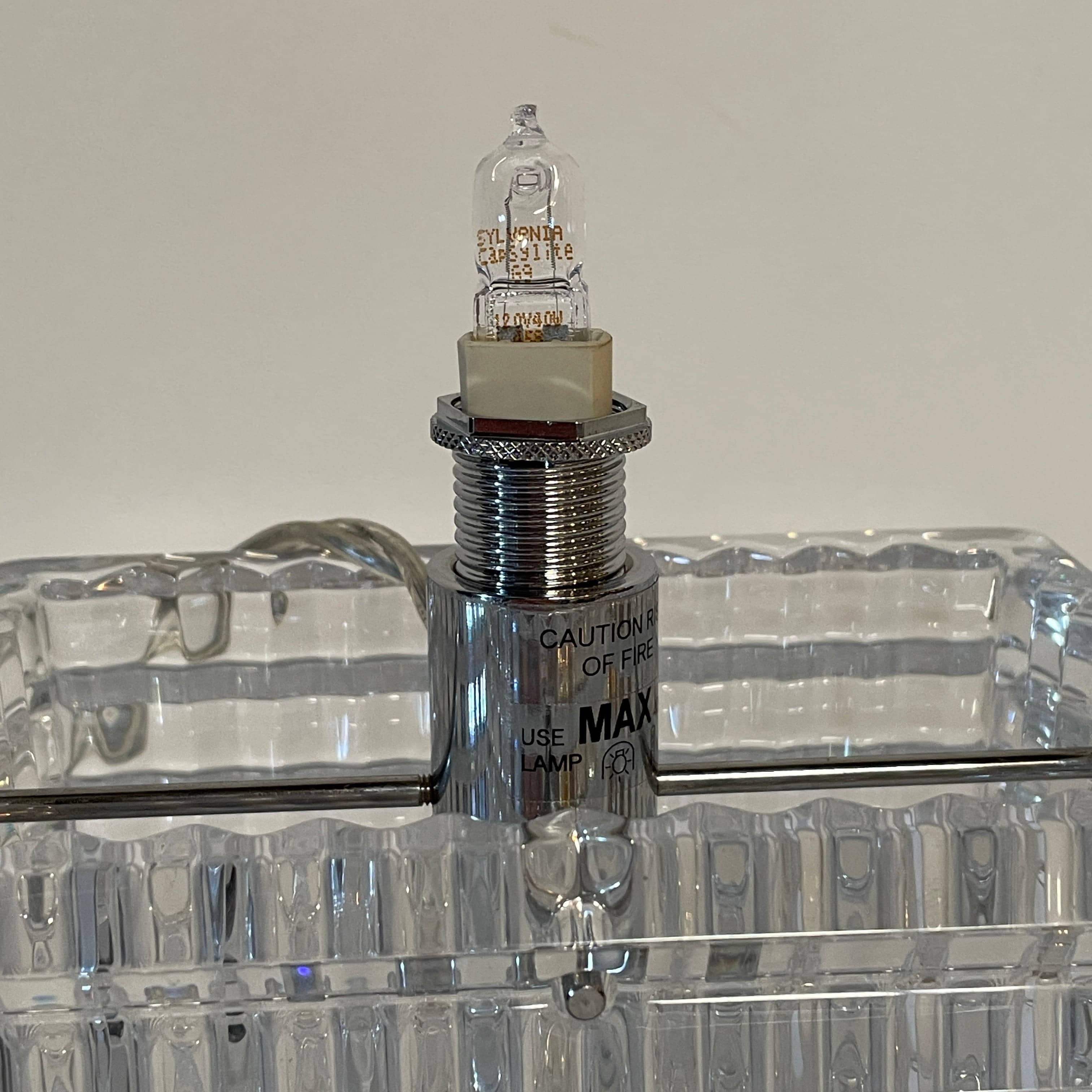 An elegant Baccarat Eye Table Lamp with a white shade designed by Nicolas Triboulot.