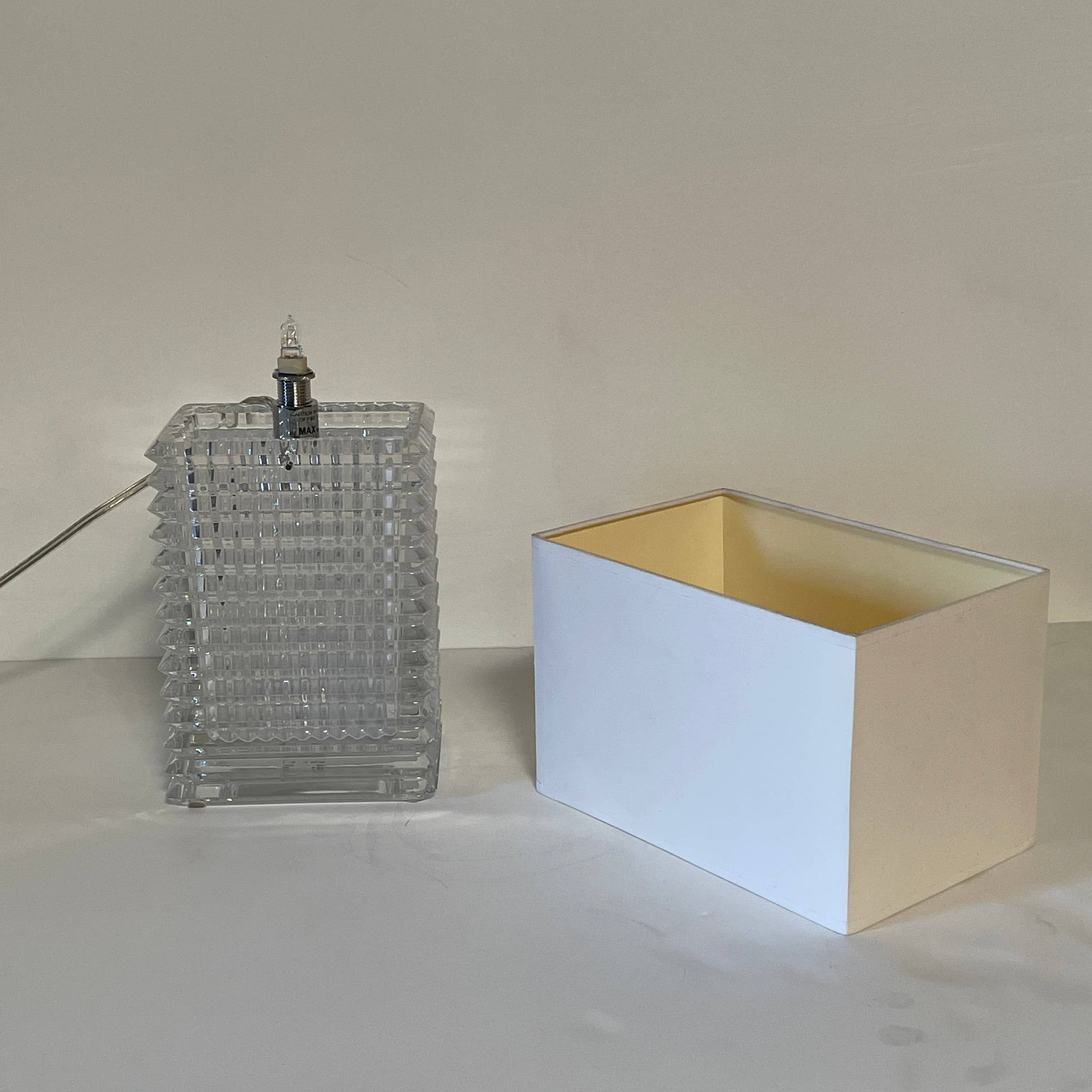 An elegant Baccarat Eye Table Lamp with a white shade designed by Nicolas Triboulot.