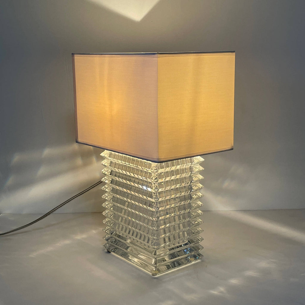 An elegant Baccarat Eye Table Lamp with a white shade designed by Nicolas Triboulot.