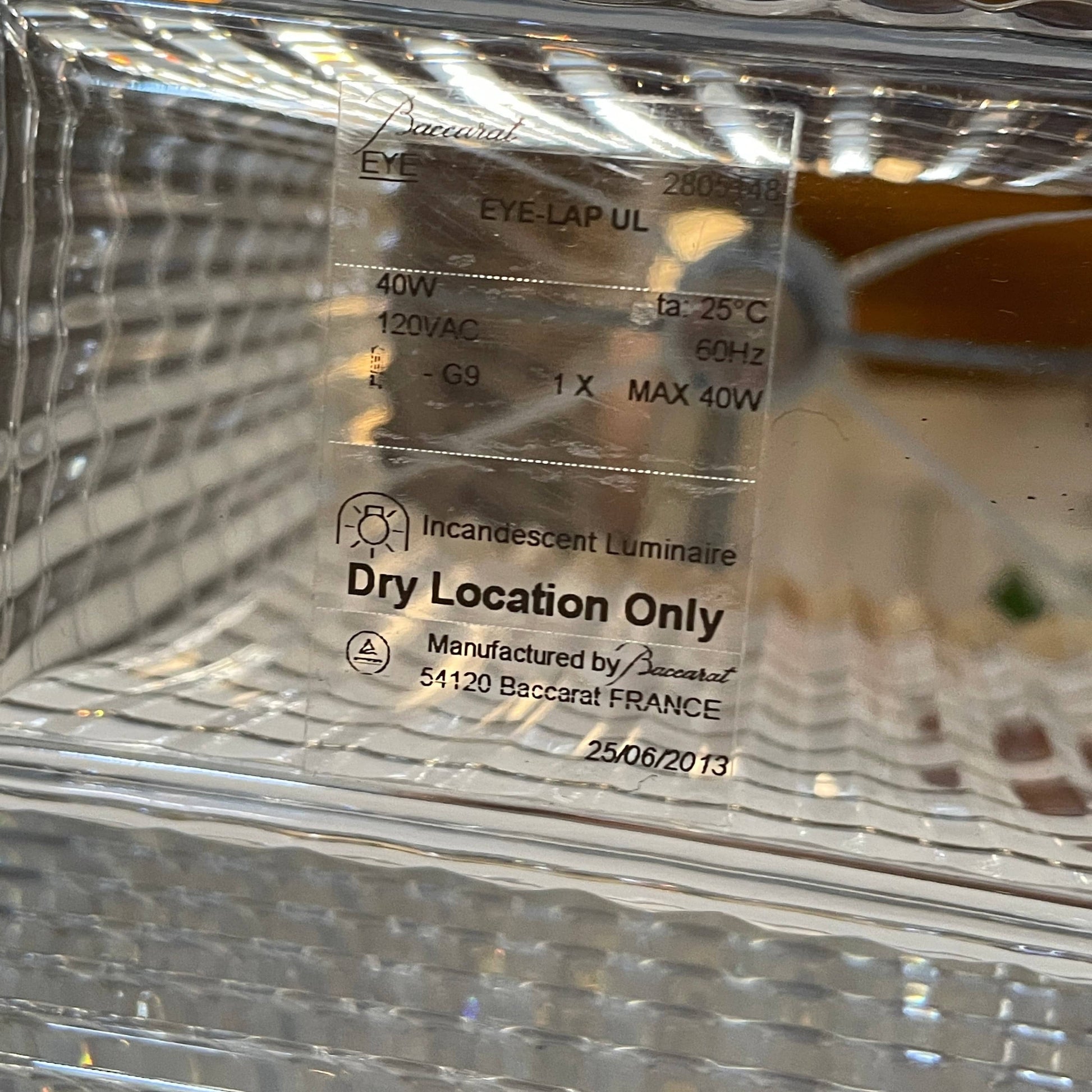 An elegant Baccarat Eye Table Lamp with a white shade designed by Nicolas Triboulot.