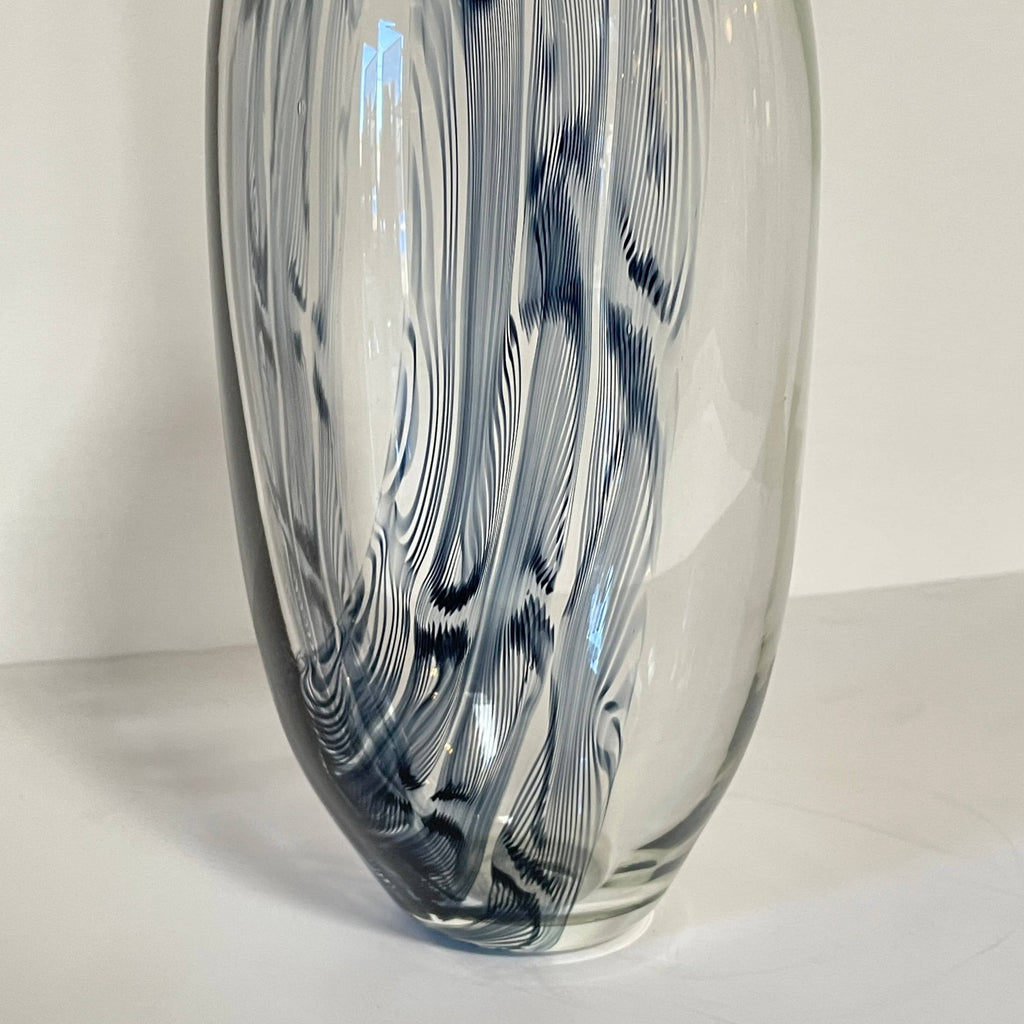 Three Glass Sculptures by Lianne Gold on a white surface, showcasing contemporary design.
