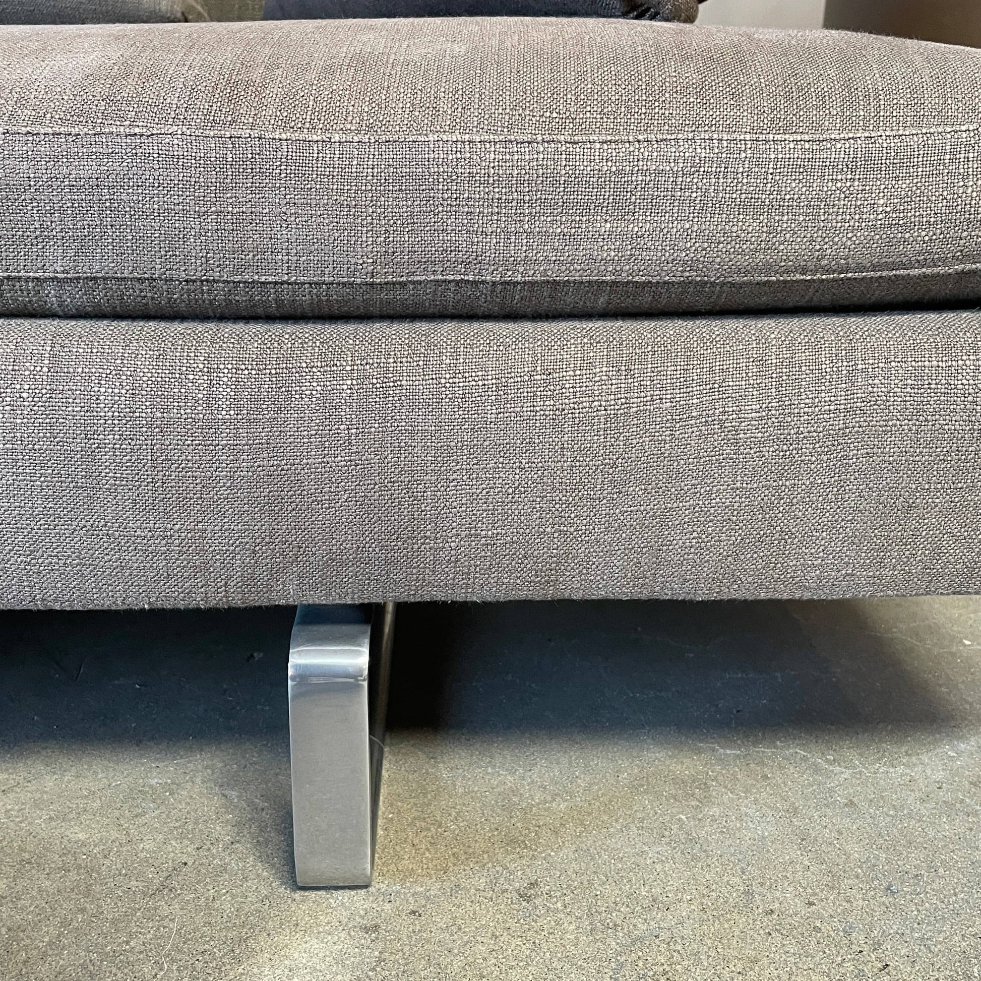 Modern upholstered l-shaped sectional B&B Italia Arne Sofa designed by Antonio Citterio, with cushions on a white background.