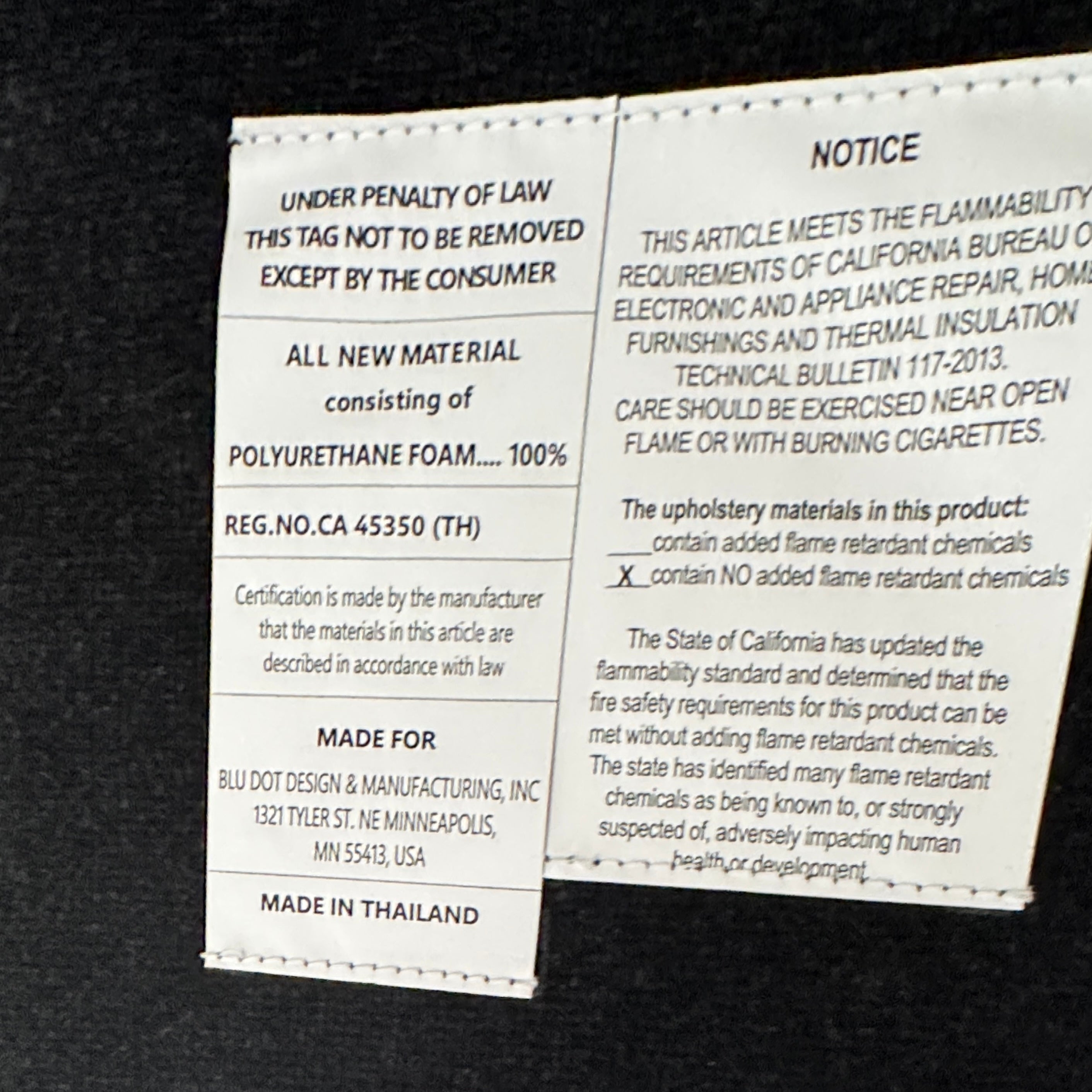 Four Blu Dot Neat Dining Chairs (set of 4, gray) from Blu Dot are lined up against a white wall on a brown concrete floor, highlighting a minimalist and tidy atmosphere.
