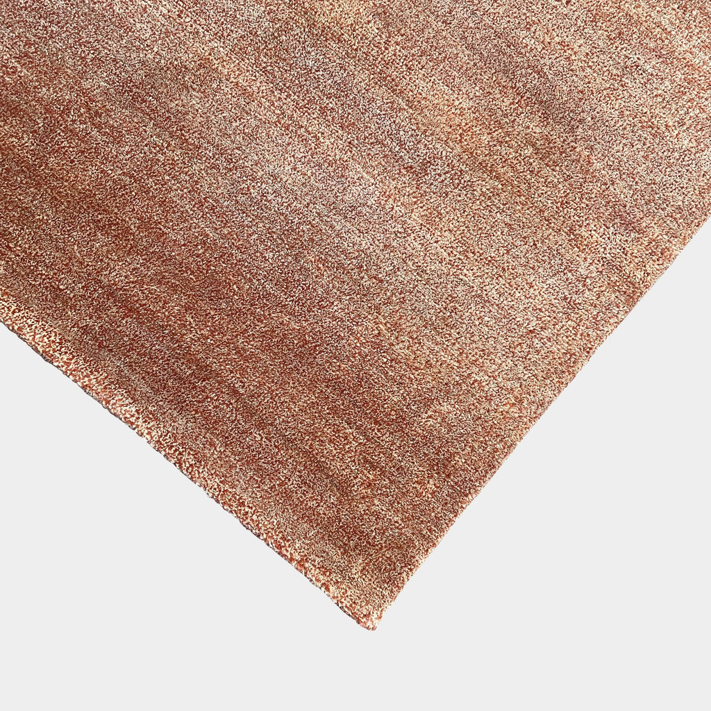 A Delinear Speckled 8' x 10' Rug with a brown color on a white background made from New Zealand wool.