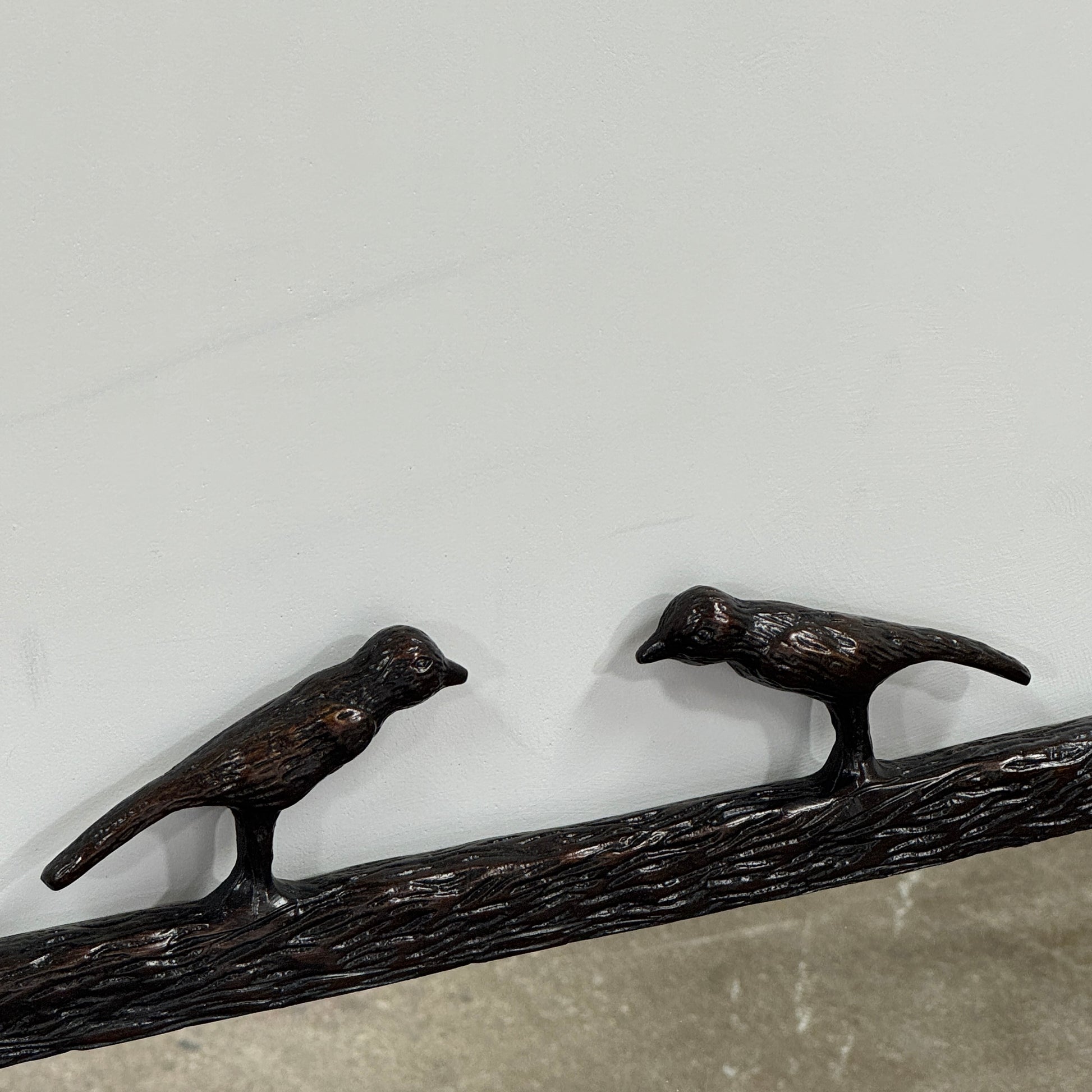 The Made Goods Joelle Three Birds Mirror is a rectangular wall mirror with a dark frame and three bird-shaped accents on its top edge, shown against a plain light background.