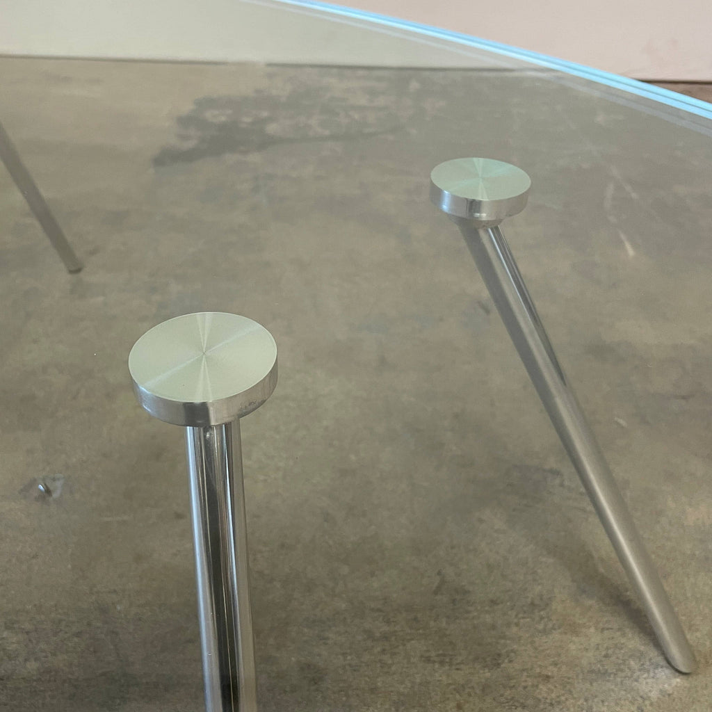 A Van Beek Maupertuus Oval coffee table with metal legs on a white background.