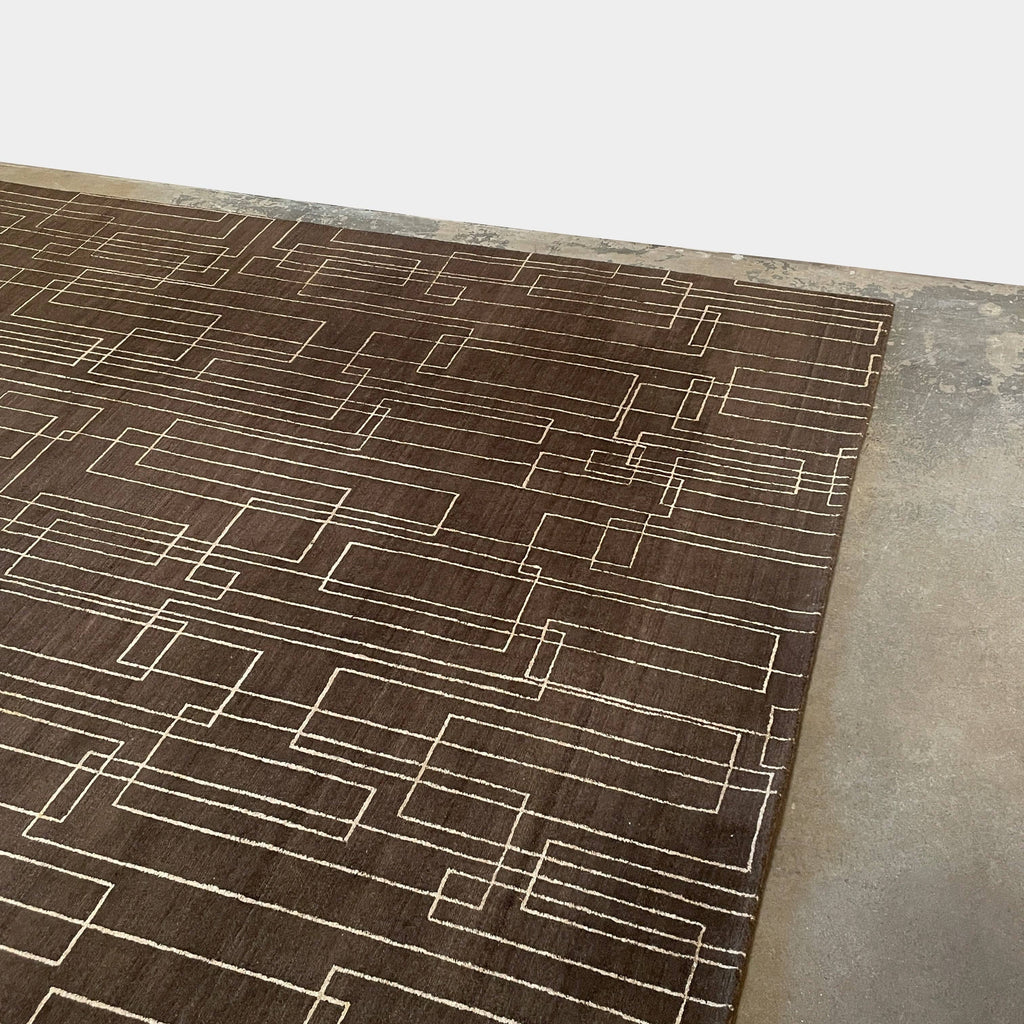 A brown Delinear Presence 8x10 wool rug with geometric lines on it.