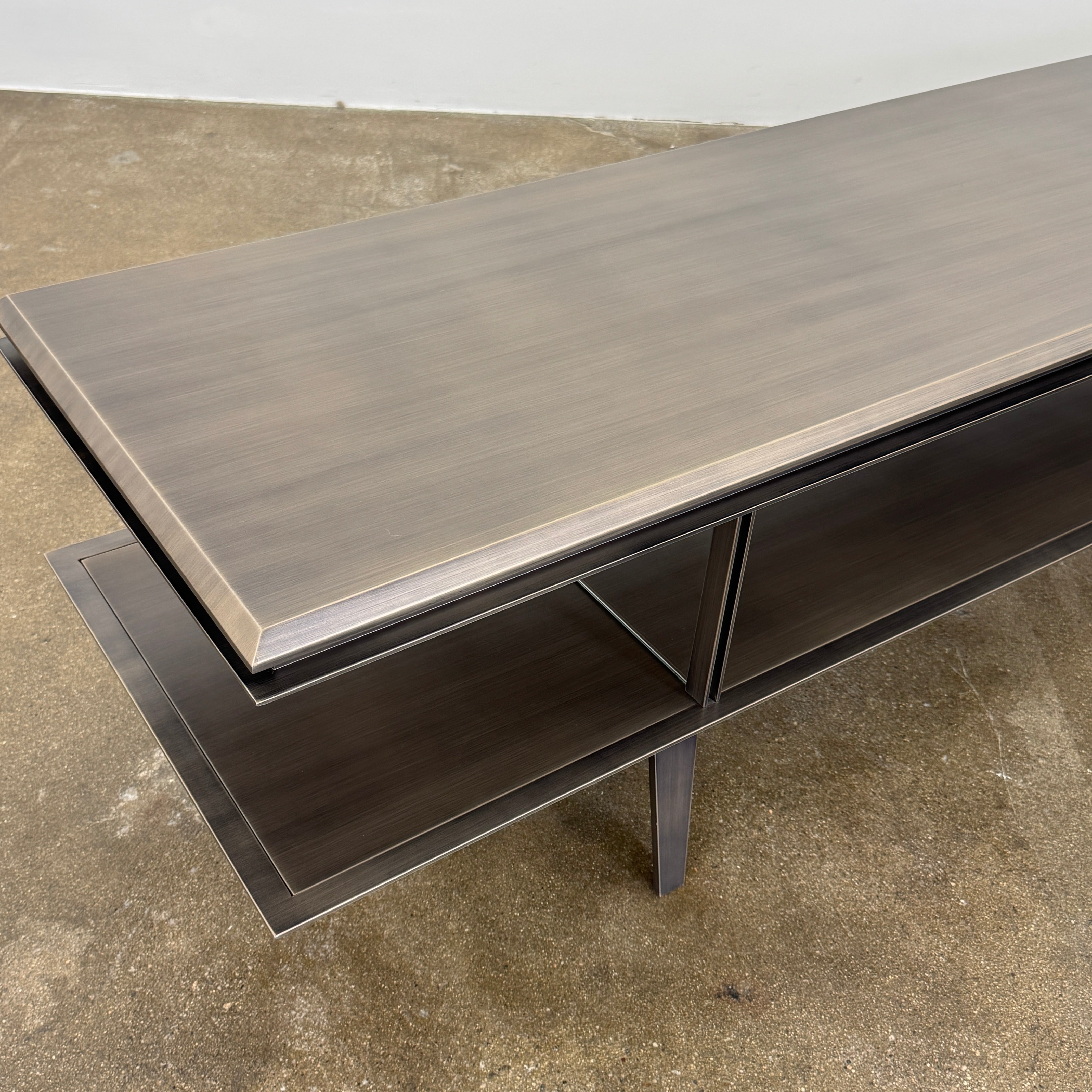 The Gallotti & Radice Pandora Console is a modern black TV stand featuring two open shelves and slim legs, shown on a plain white background. Check dimensions to ensure it fits your space perfectly.