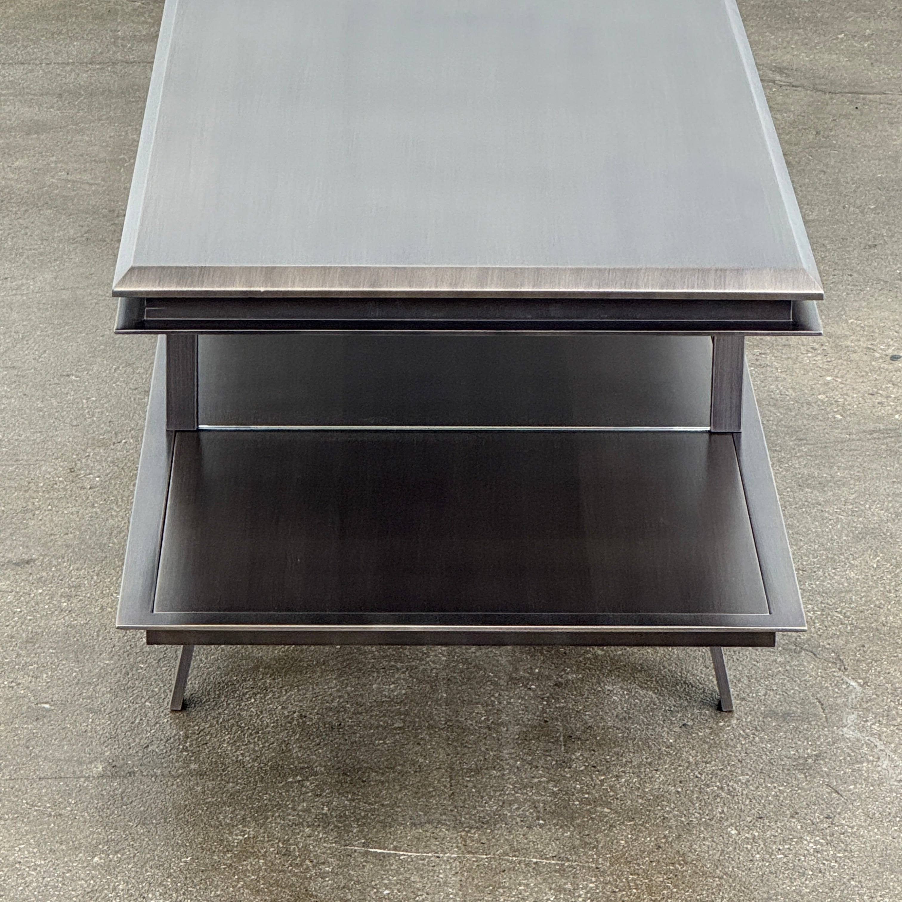 The Gallotti & Radice Pandora Console is a modern black TV stand featuring two open shelves and slim legs, shown on a plain white background. Check dimensions to ensure it fits your space perfectly.