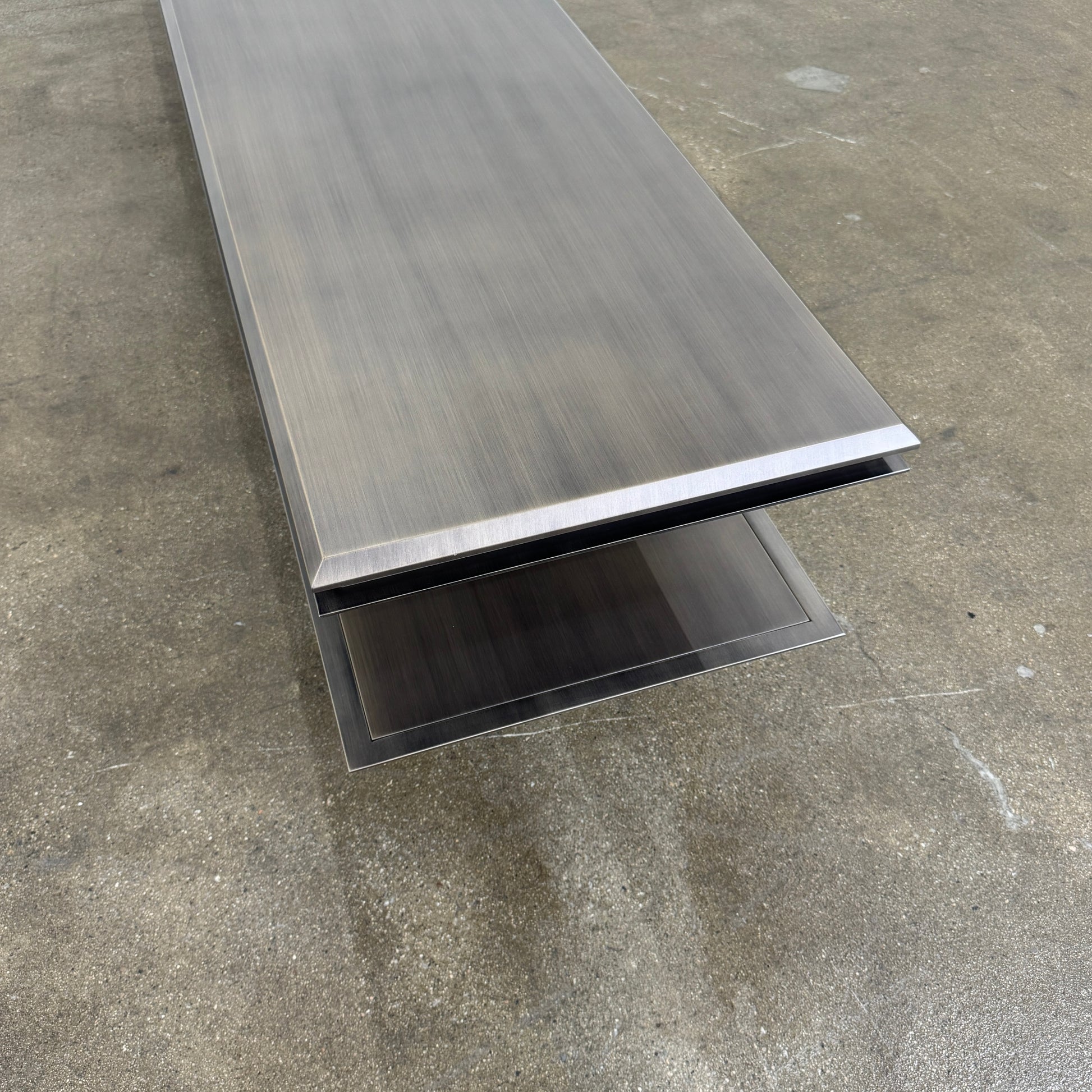 The Gallotti & Radice Pandora Console is a modern black TV stand featuring two open shelves and slim legs, shown on a plain white background. Check dimensions to ensure it fits your space perfectly.