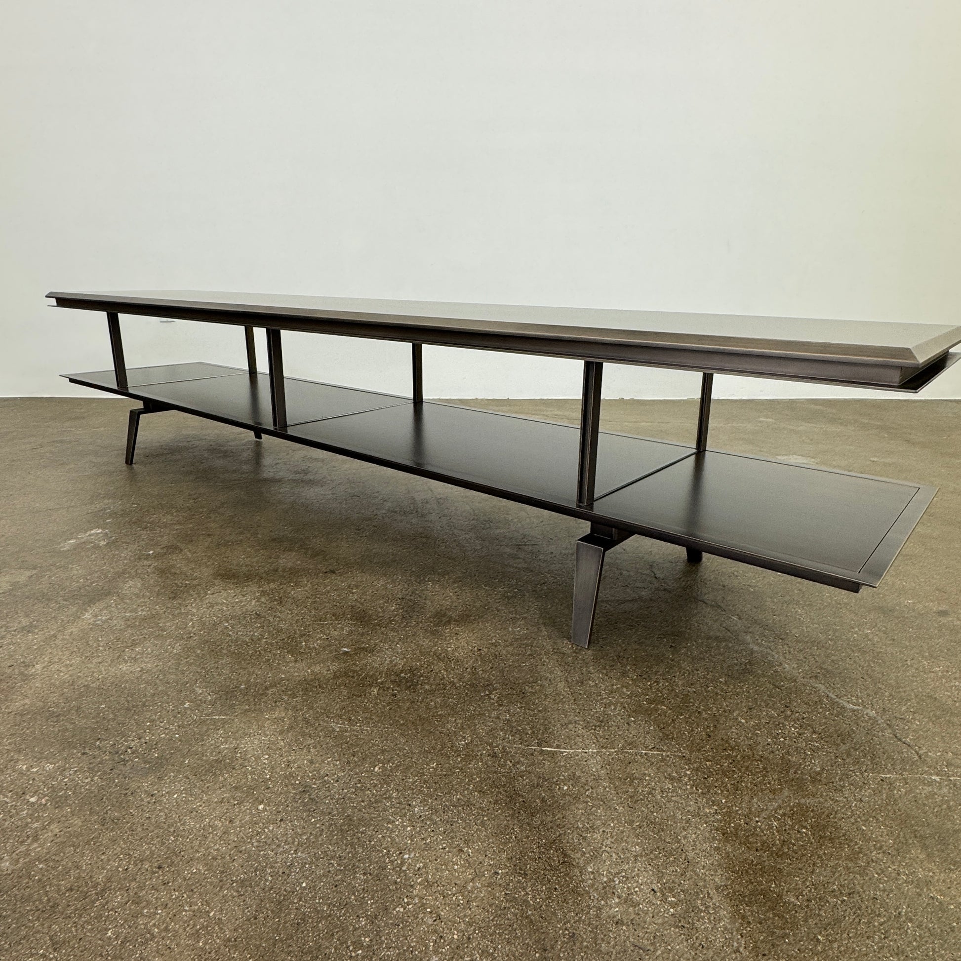 The Gallotti & Radice Pandora Console is a modern black TV stand featuring two open shelves and slim legs, shown on a plain white background. Check dimensions to ensure it fits your space perfectly.