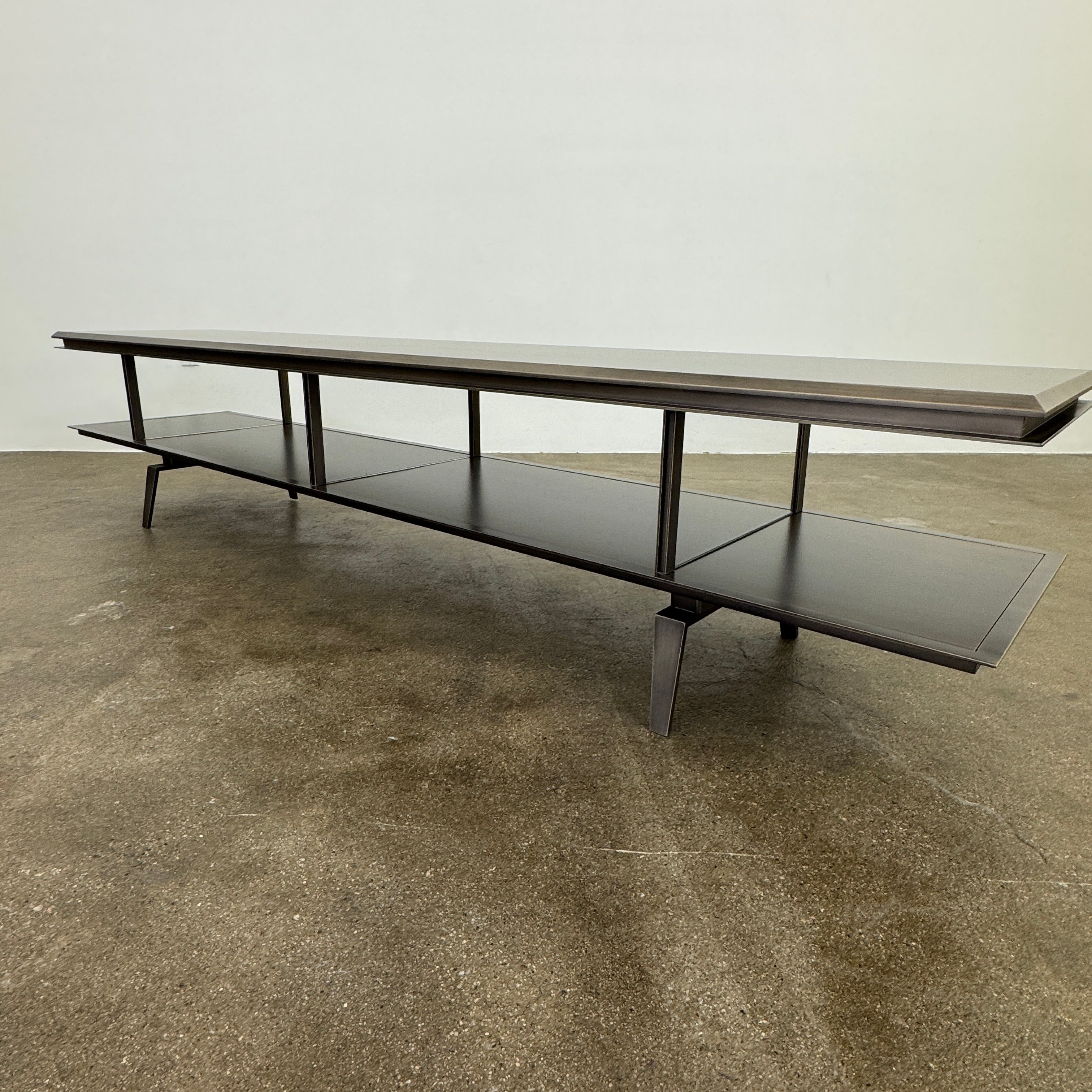 The Gallotti & Radice Pandora Console is a modern black TV stand featuring two open shelves and slim legs, shown on a plain white background. Check dimensions to ensure it fits your space perfectly.