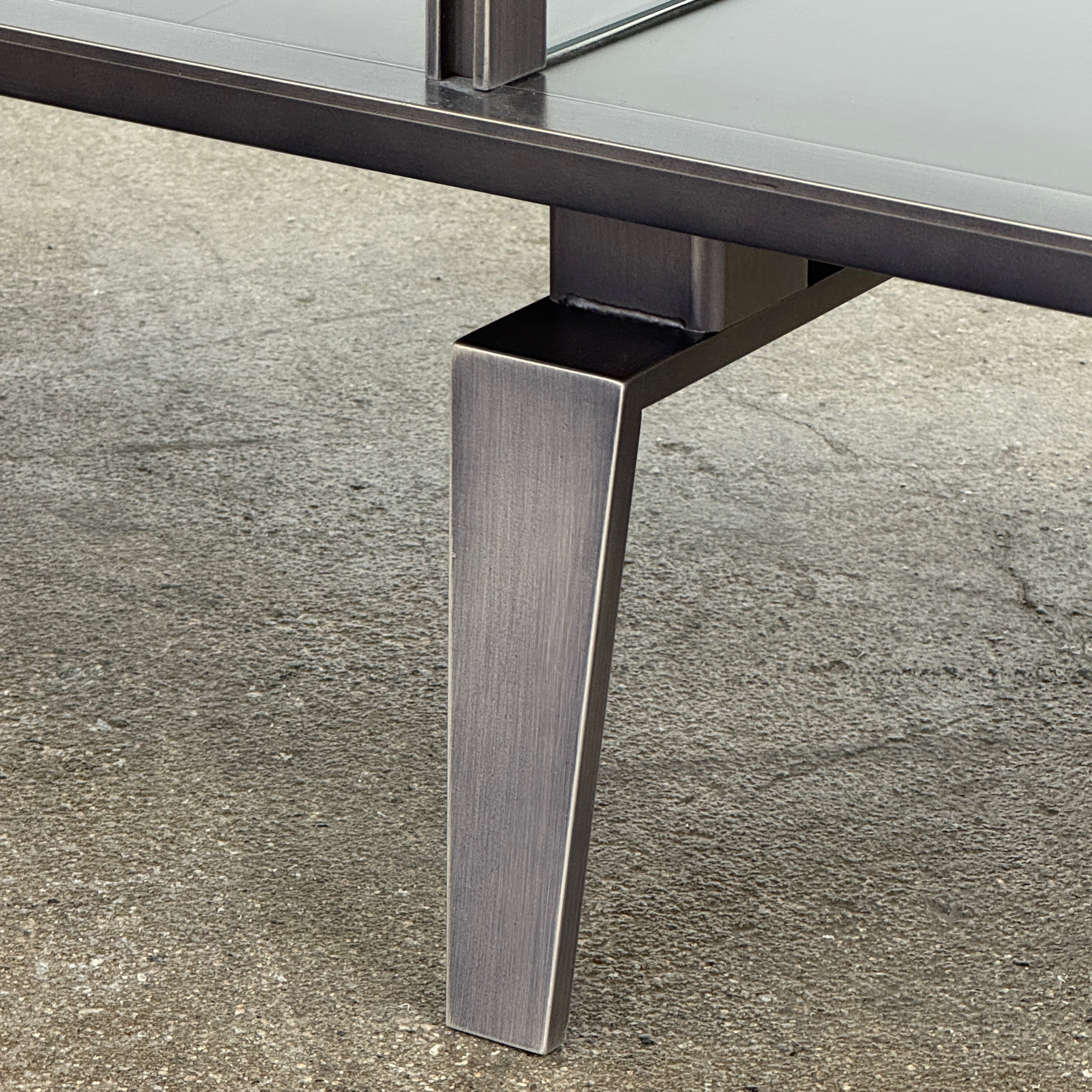 The Gallotti & Radice Pandora Console is a modern black TV stand featuring two open shelves and slim legs, shown on a plain white background. Check dimensions to ensure it fits your space perfectly.