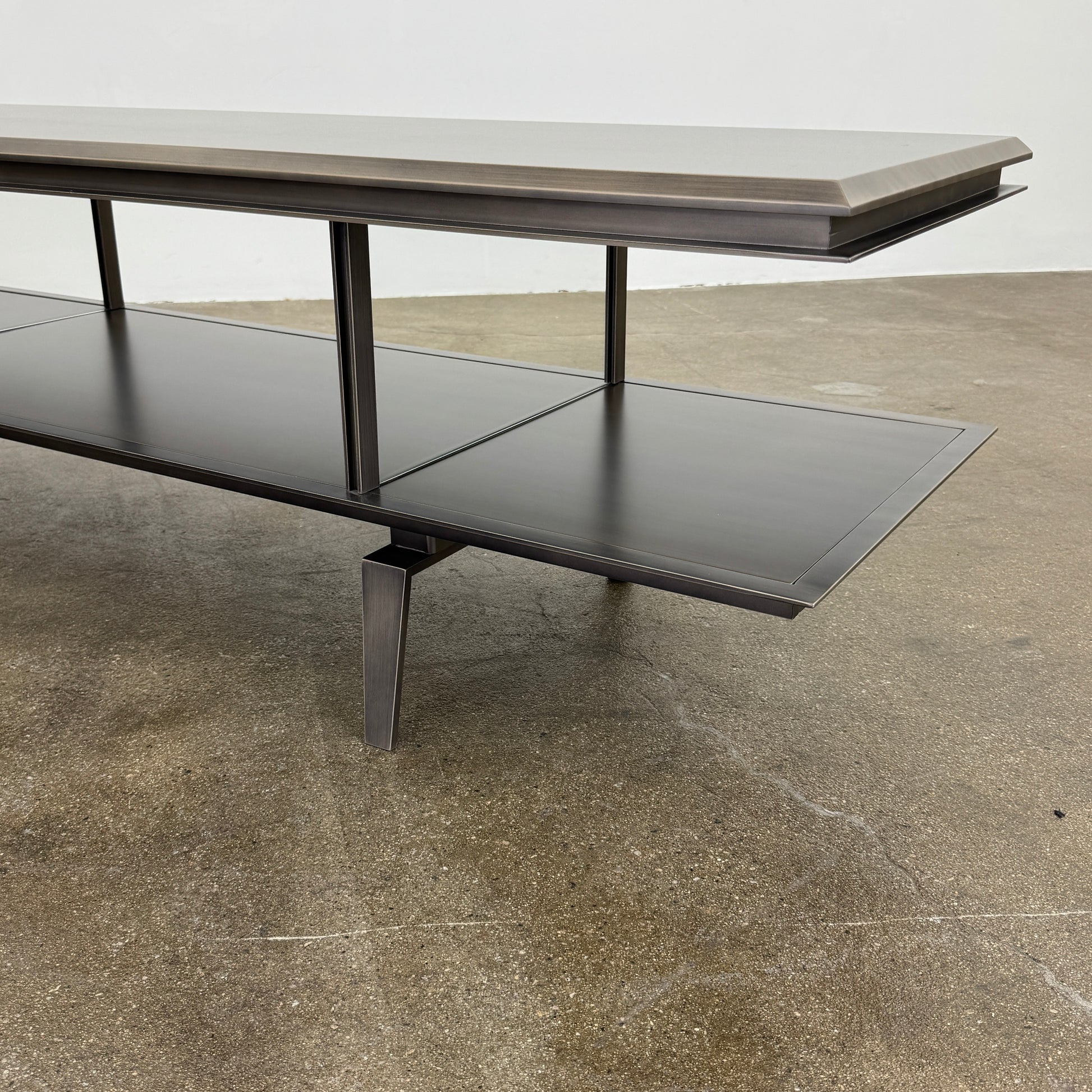 The Gallotti & Radice Pandora Console is a modern black TV stand featuring two open shelves and slim legs, shown on a plain white background. Check dimensions to ensure it fits your space perfectly.