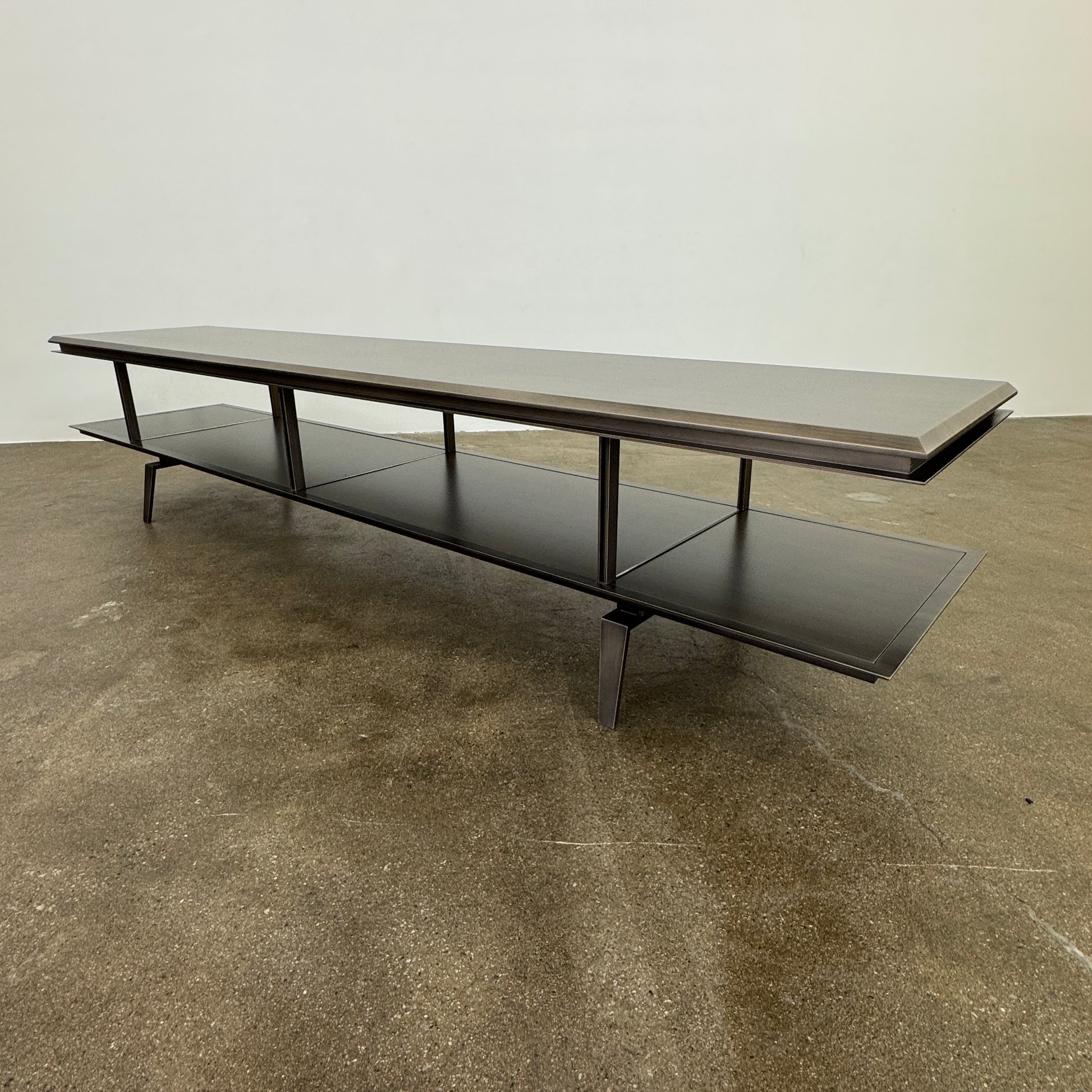 The Gallotti & Radice Pandora Console is a modern black TV stand featuring two open shelves and slim legs, shown on a plain white background. Check dimensions to ensure it fits your space perfectly.