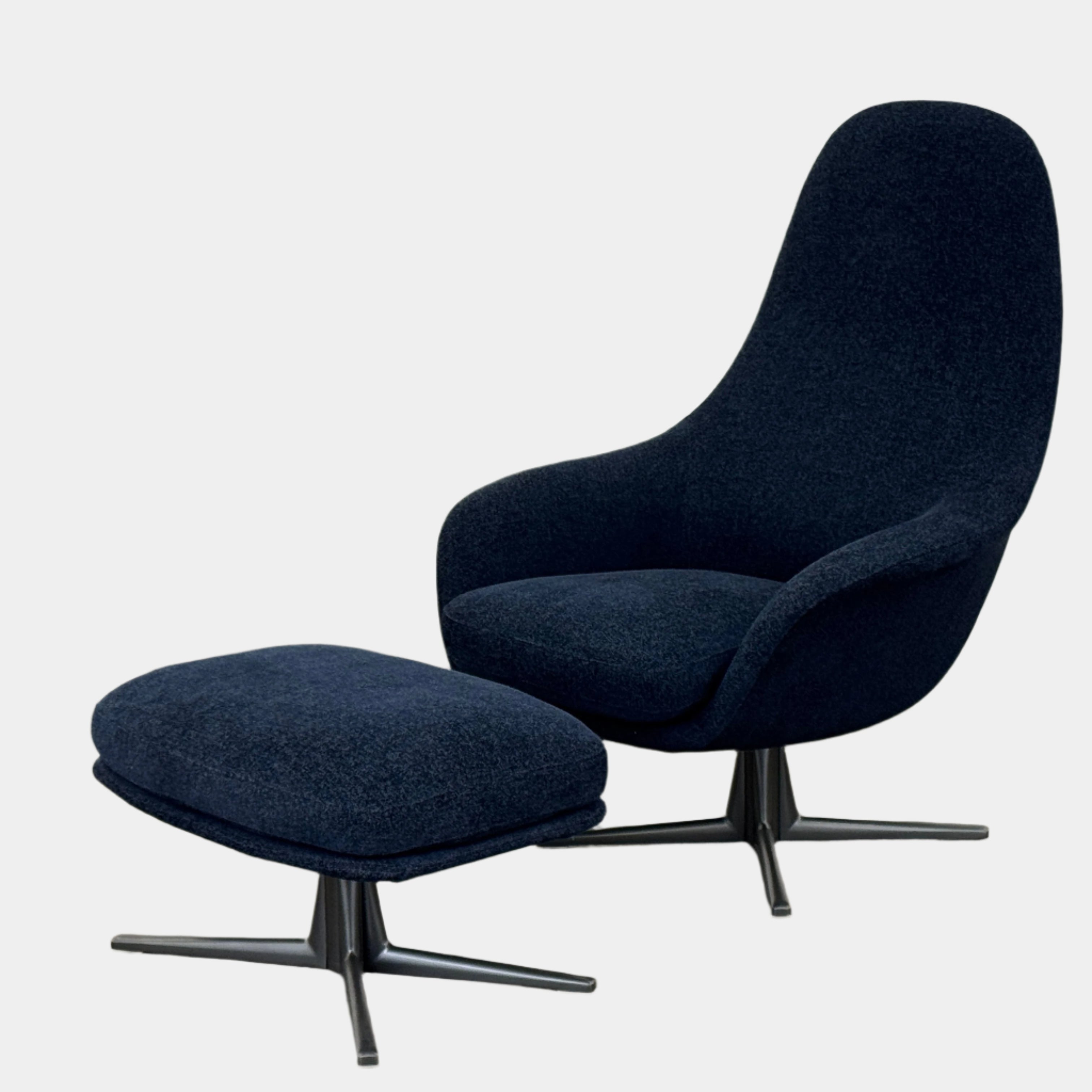 The Flexform Marlon Swivel Armchair and Ottoman, available with two covers, feature ergonomic design and black metal bases from Flexform, shown here in a modern gray finish against a plain white background.