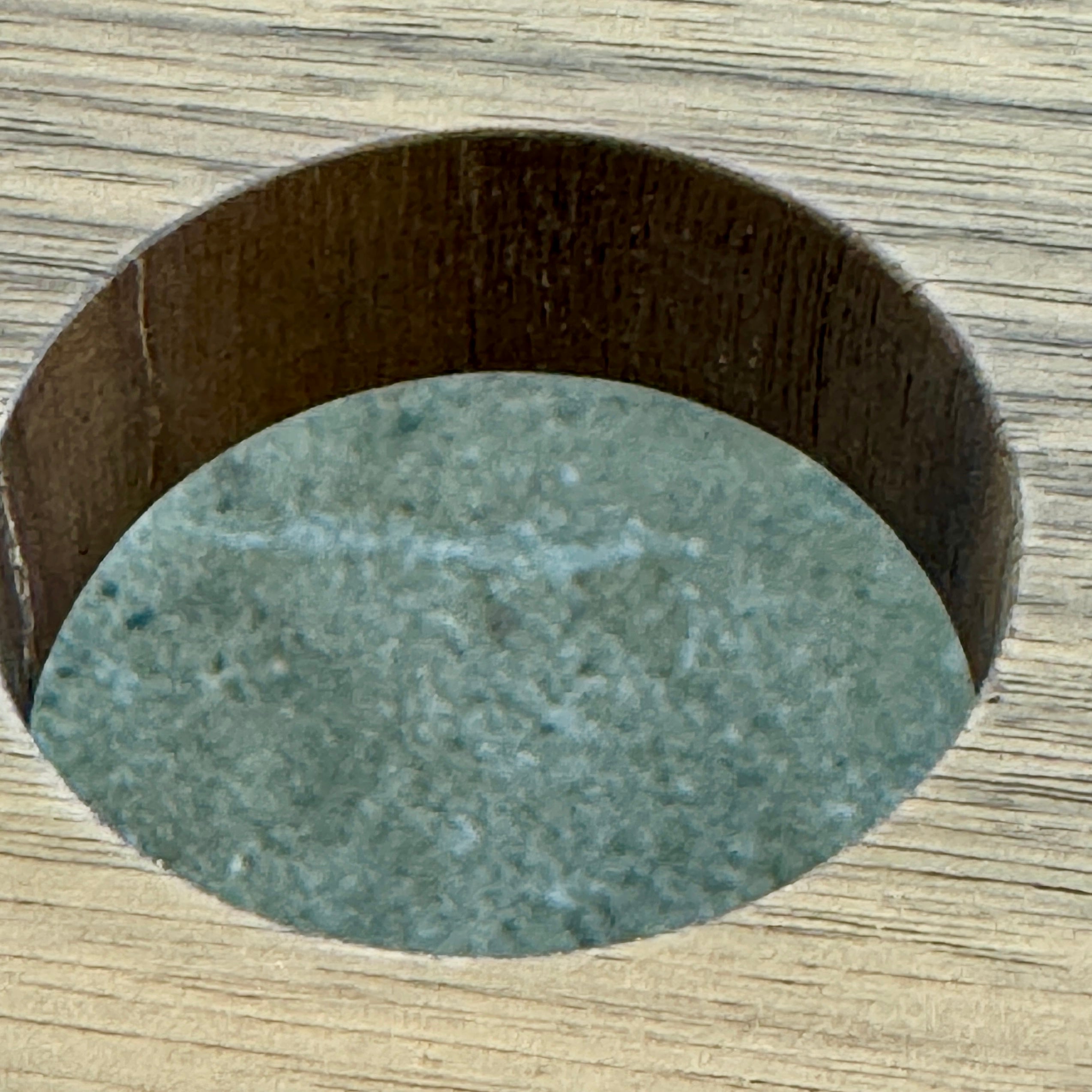 The Flexform Fly Canaletto Walnut Desk is a custom wood desk with a central circular cable management hole, reflecting the refined style of Flexform.