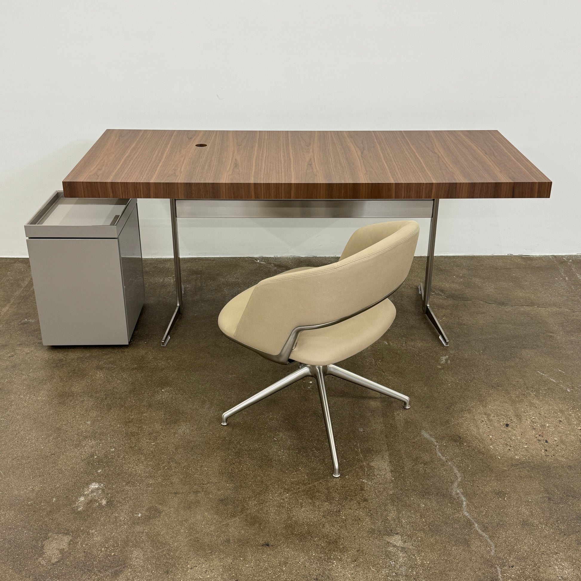 A Rev-A-Shelf instruction sheet and a "100% Thought&Made in Italy" leaflet sit on two beige trays, ideal for organizing your workspace or pairing with the Flexform Benjamin Chest of Drawers With File Insert.