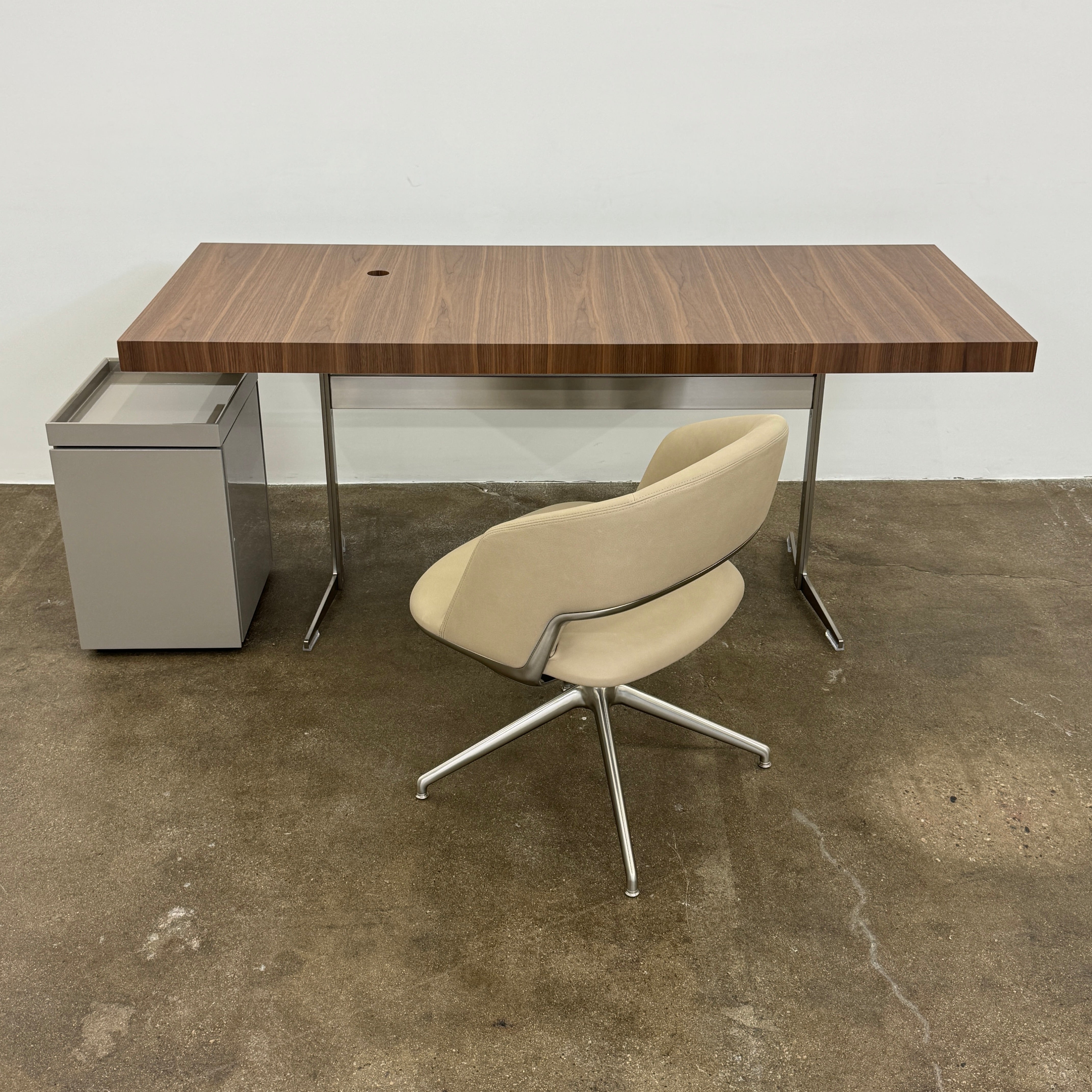 A Rev-A-Shelf instruction sheet and a "100% Thought&Made in Italy" leaflet sit on two beige trays, ideal for organizing your workspace or pairing with the Flexform Benjamin Chest of Drawers With File Insert.