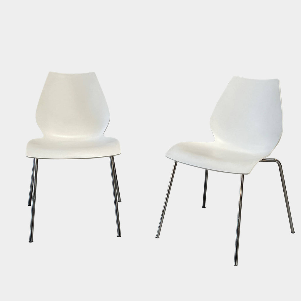 A comfortable Kartell Maui Dining Chair Set, elegantly positioned against a pristine white background.