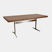 The Flexform Fly Canaletto Walnut Desk is a custom wood desk with a central circular cable management hole, reflecting the refined style of Flexform.