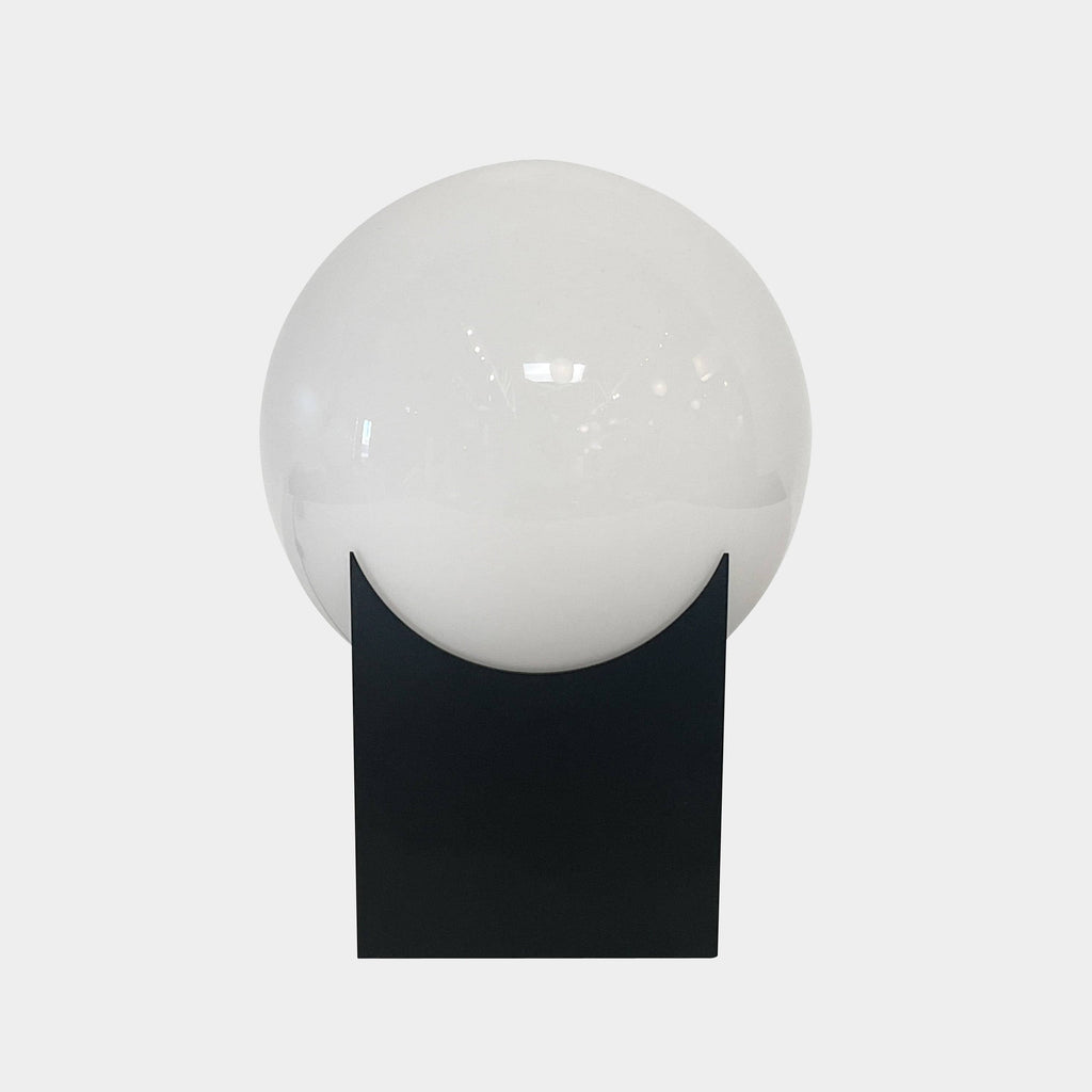 The Roll & Hill Atlas 01 Table Lamp, a white sphere on a black base, is a stunning table lamp by Roll & Hill.