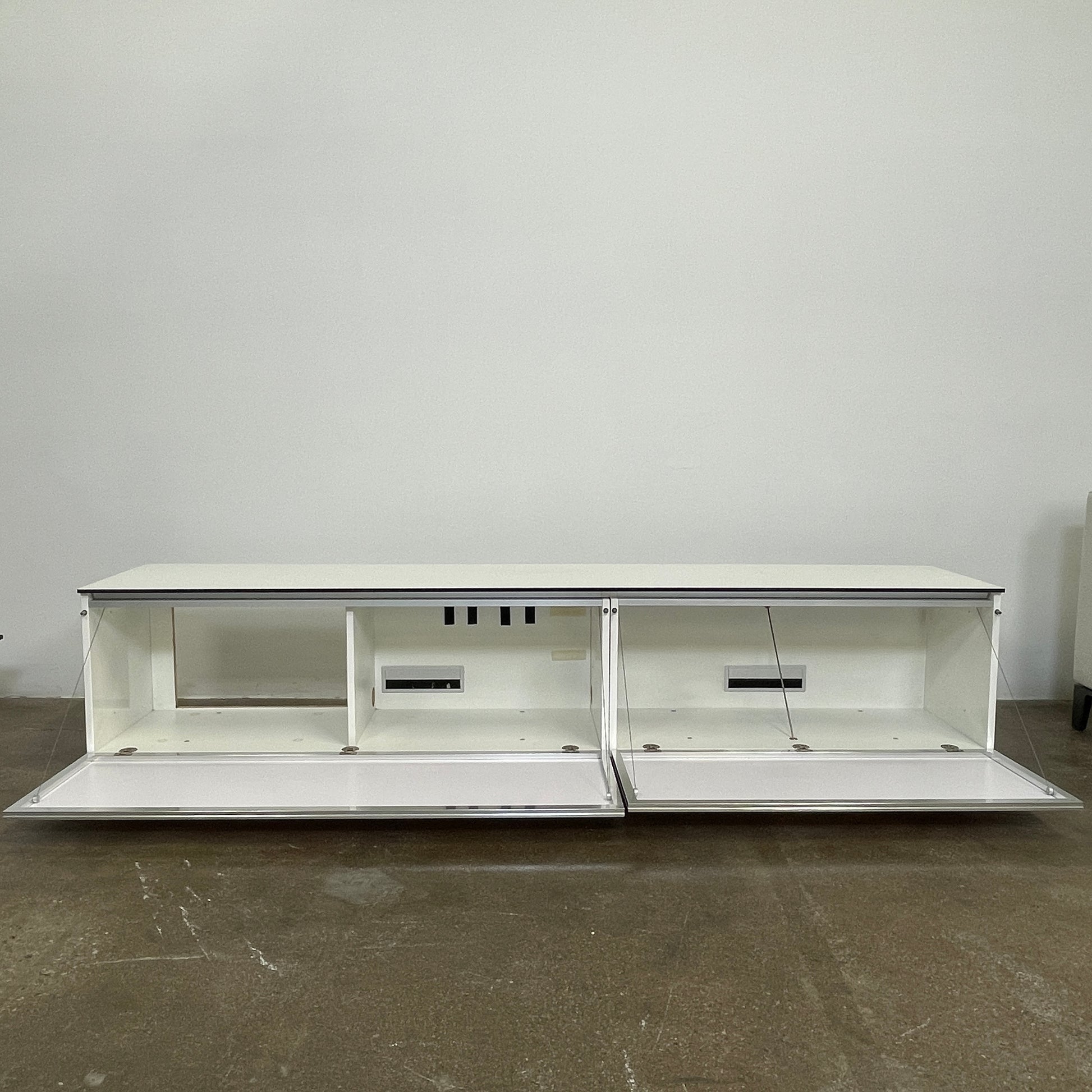 The B&B Italia Pab Low Console by B&B Italia is a rectangular, low-profile media console with glossy pearl white doors and two doors, perfect for stylish storage, shown against a plain white background.