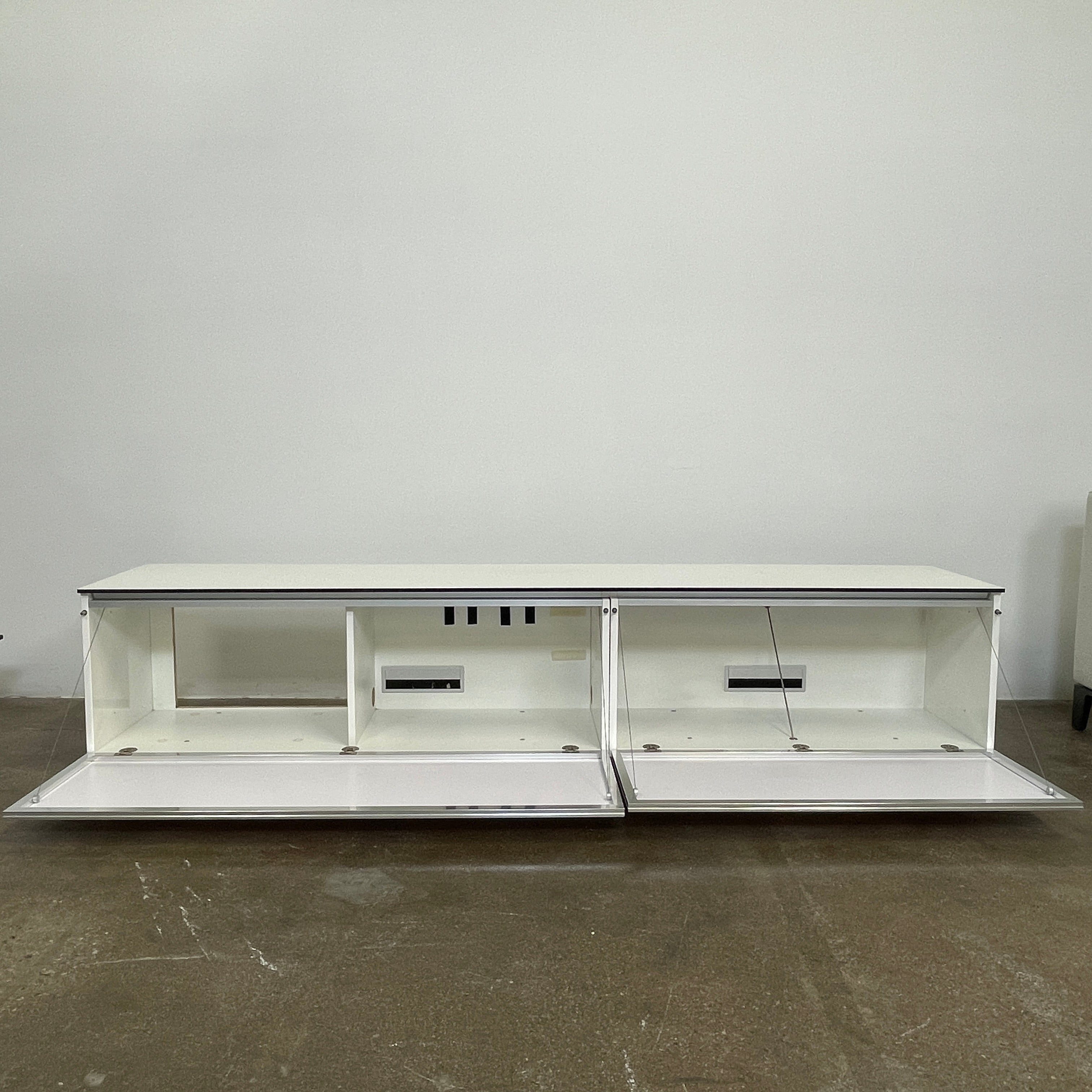 The B&B Italia Pab Low Console by B&B Italia is a rectangular, low-profile media console with glossy pearl white doors and two doors, perfect for stylish storage, shown against a plain white background.