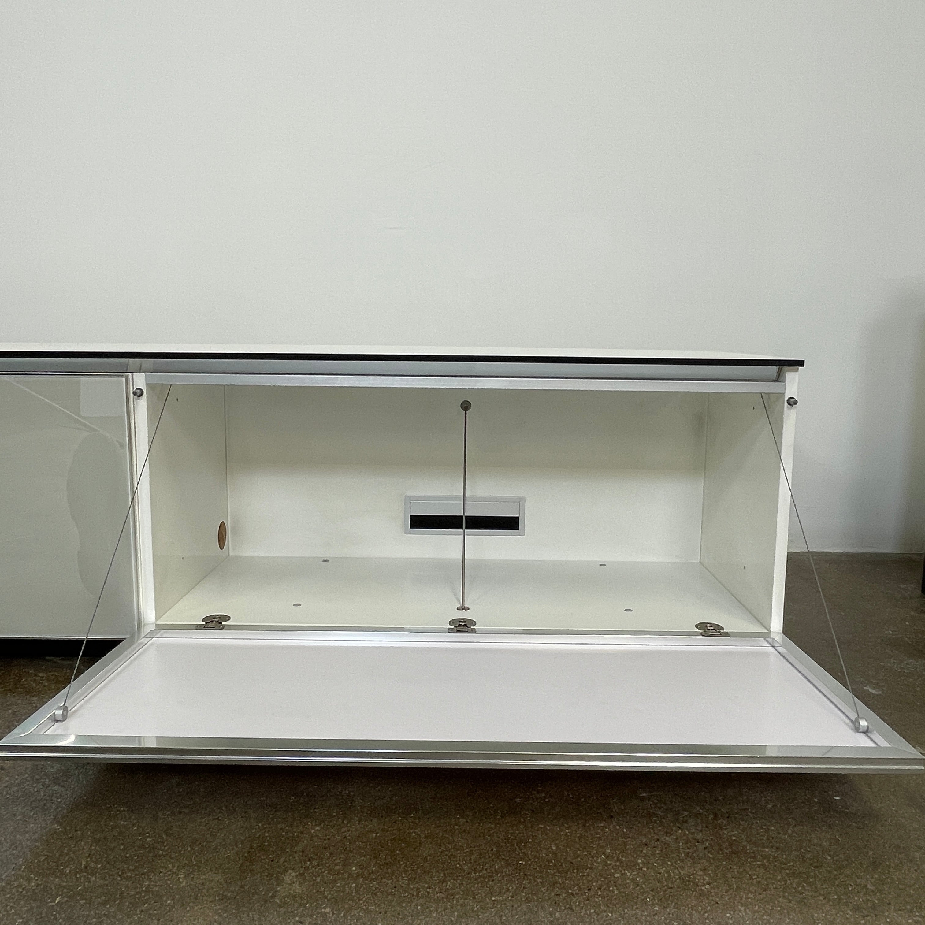 The B&B Italia Pab Low Console by B&B Italia is a rectangular, low-profile media console with glossy pearl white doors and two doors, perfect for stylish storage, shown against a plain white background.