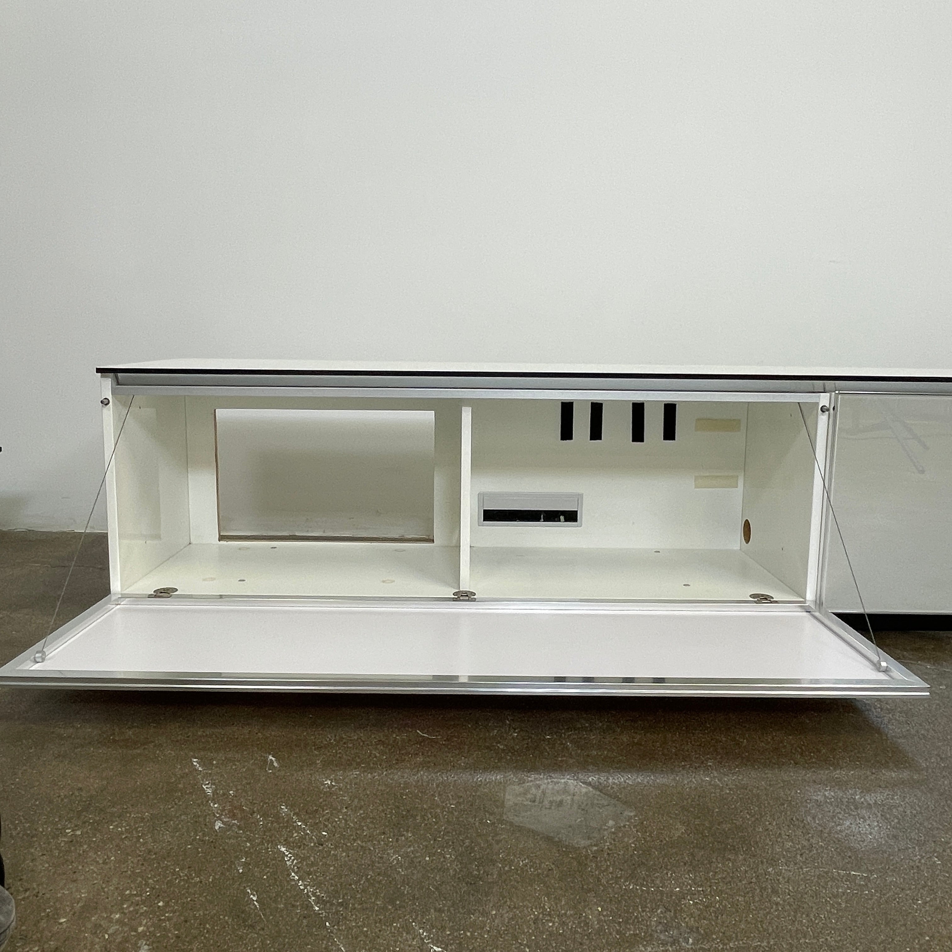 The B&B Italia Pab Low Console by B&B Italia is a rectangular, low-profile media console with glossy pearl white doors and two doors, perfect for stylish storage, shown against a plain white background.