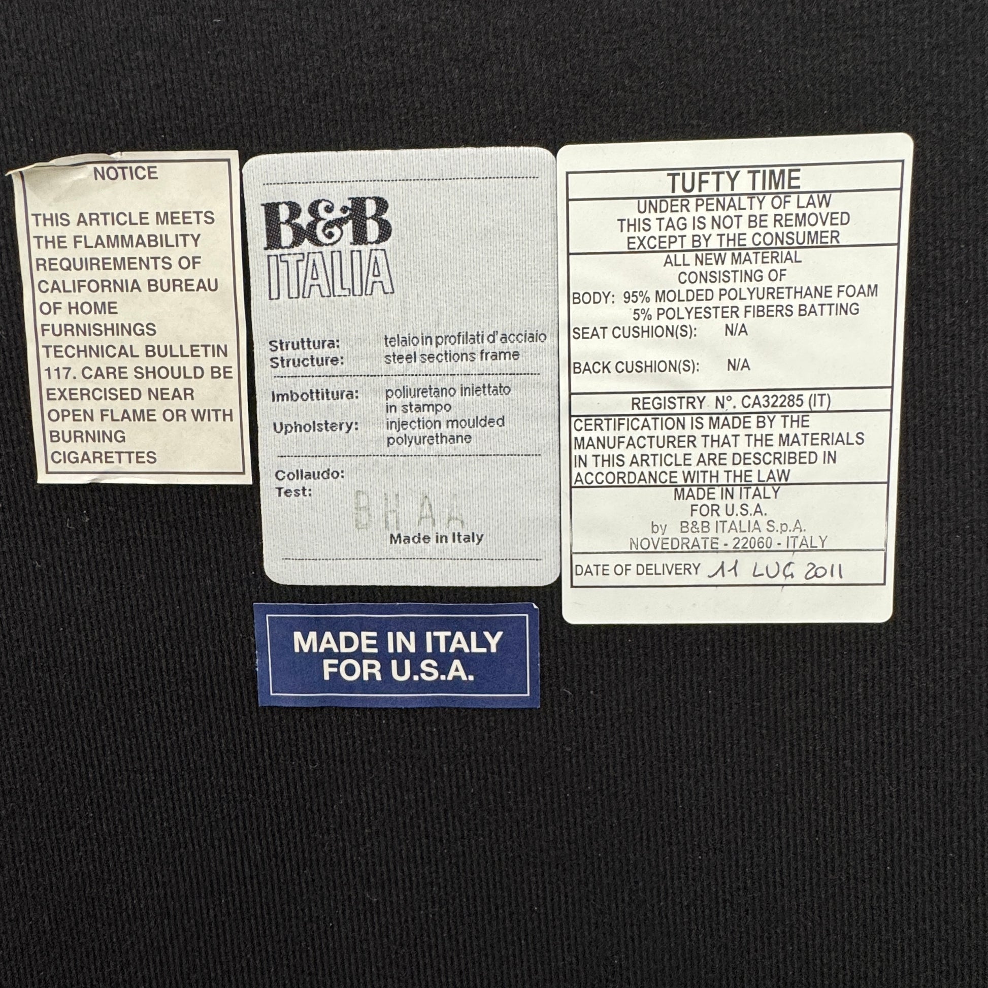 A B&B Italia 5 Piece Tufty Time Sectional with tufted cushions sits in an L-shape on a polished concrete floor against a plain white wall.