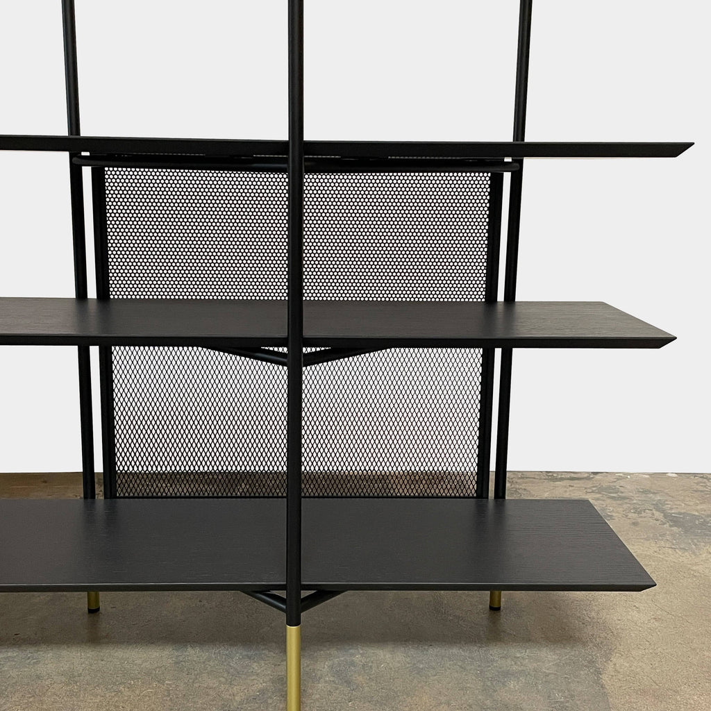 A Ligne Roset Clyde Bookcase with a mesh back.