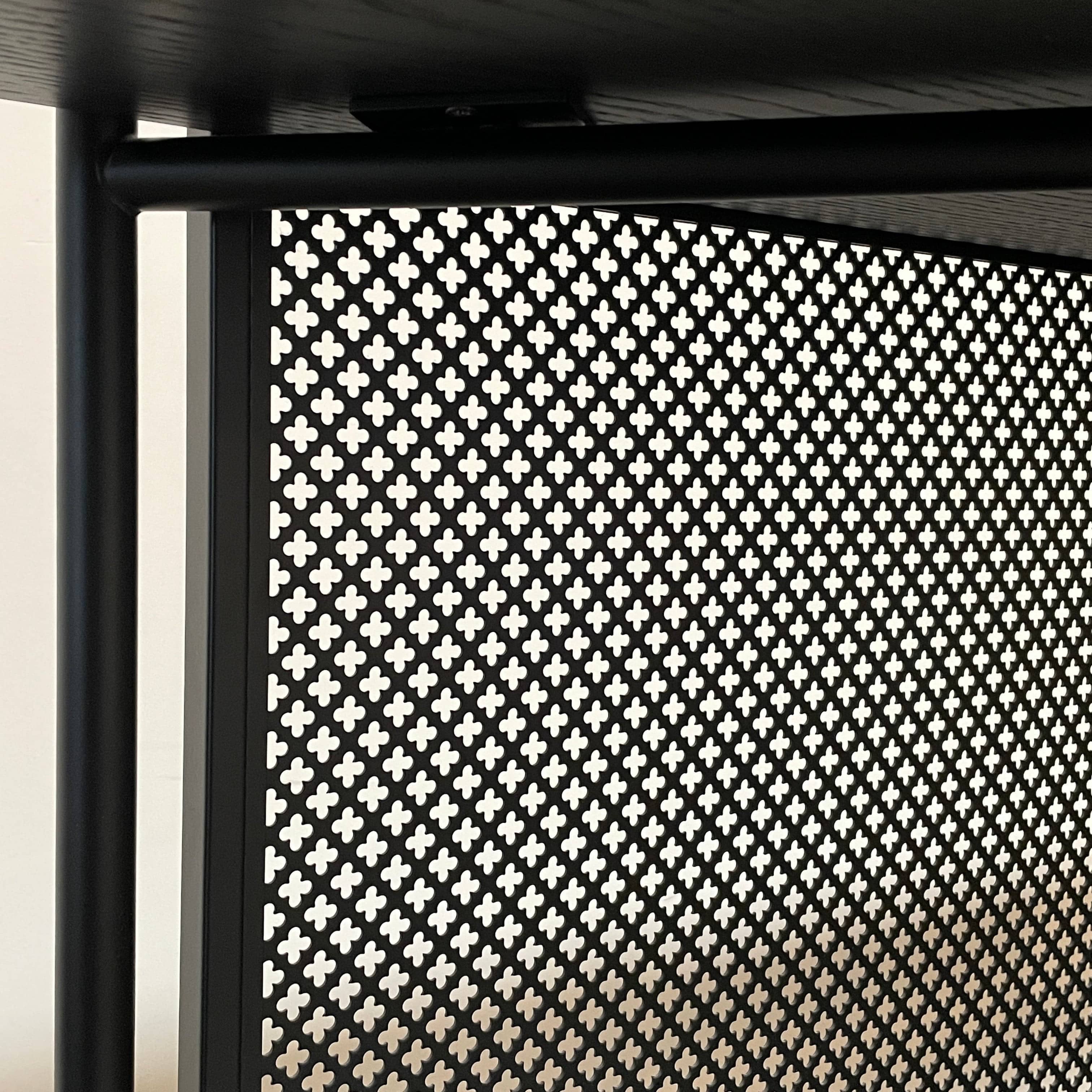 A Ligne Roset Clyde Bookcase with a mesh back.