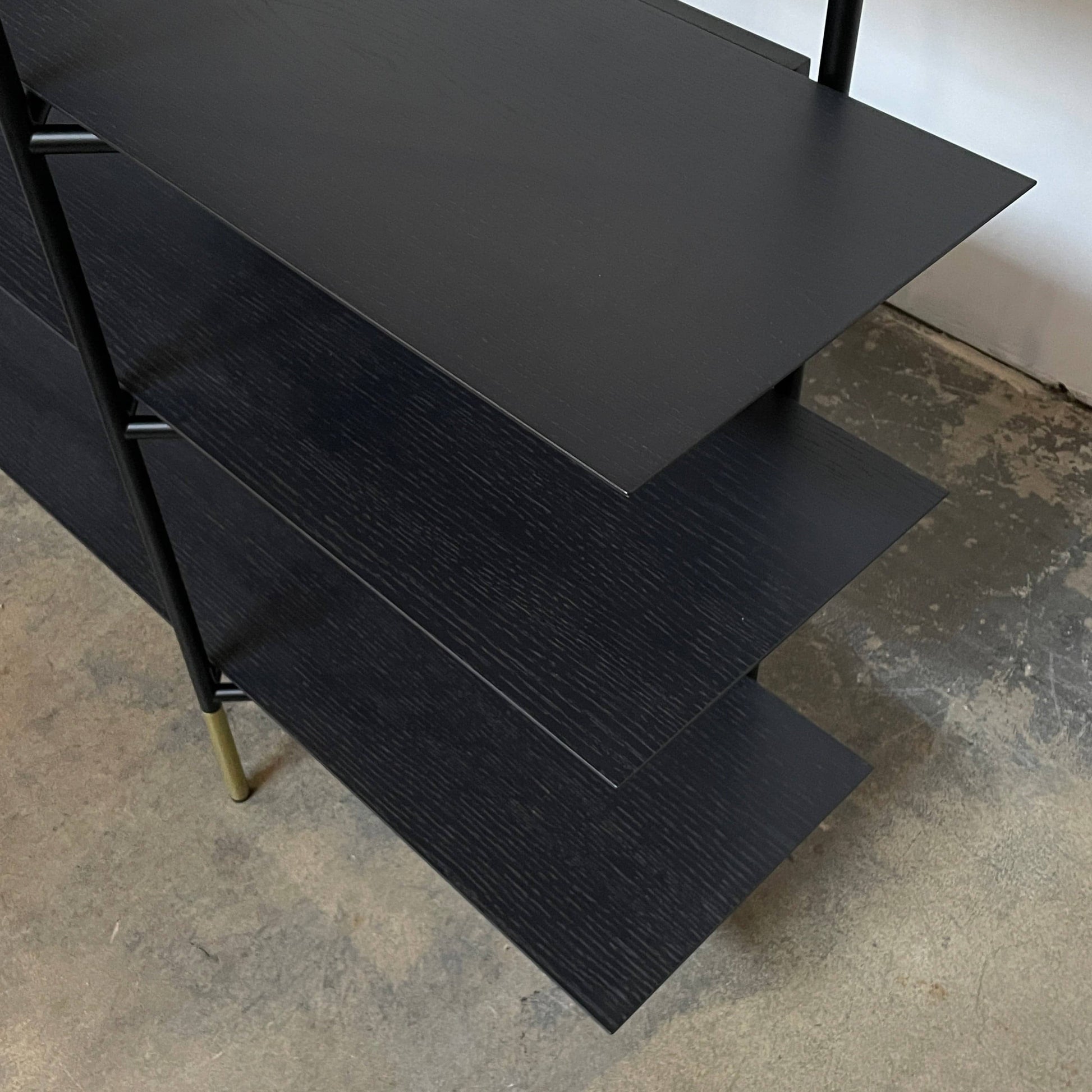 A Ligne Roset Clyde Bookcase with a mesh back.